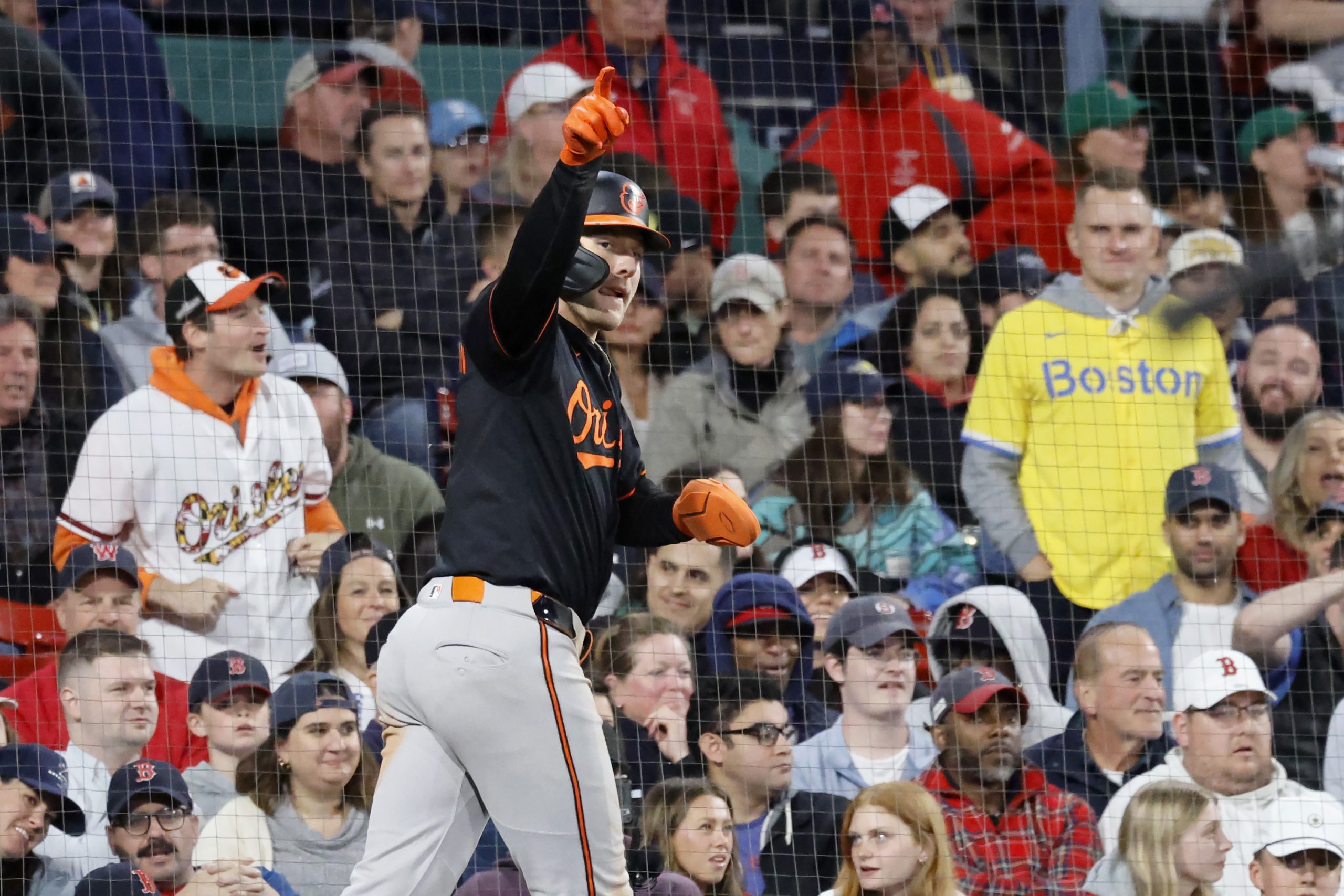 Baltimore Orioles' Gunnar Henderson reacts toward first base after scoring...