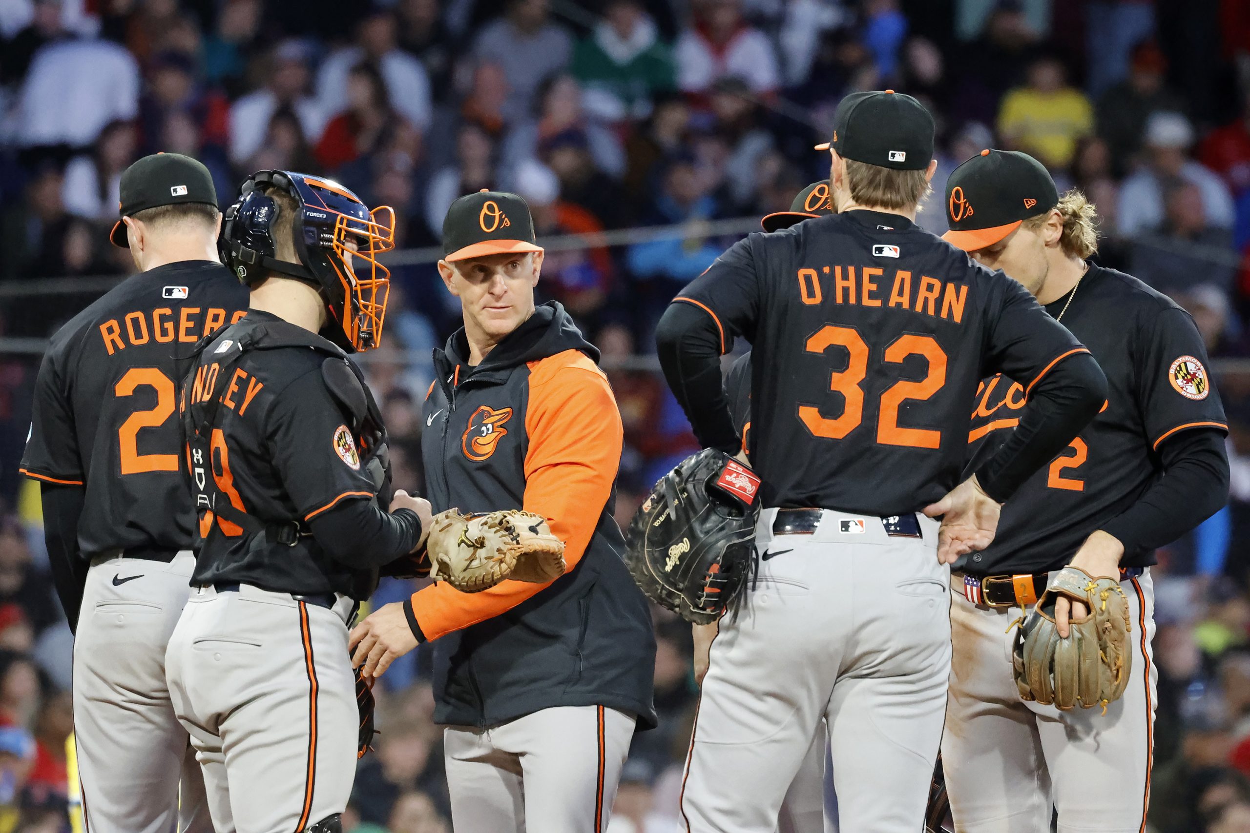 Baltimore Orioles interim manager Tony Mansolino, center, takes the ball...