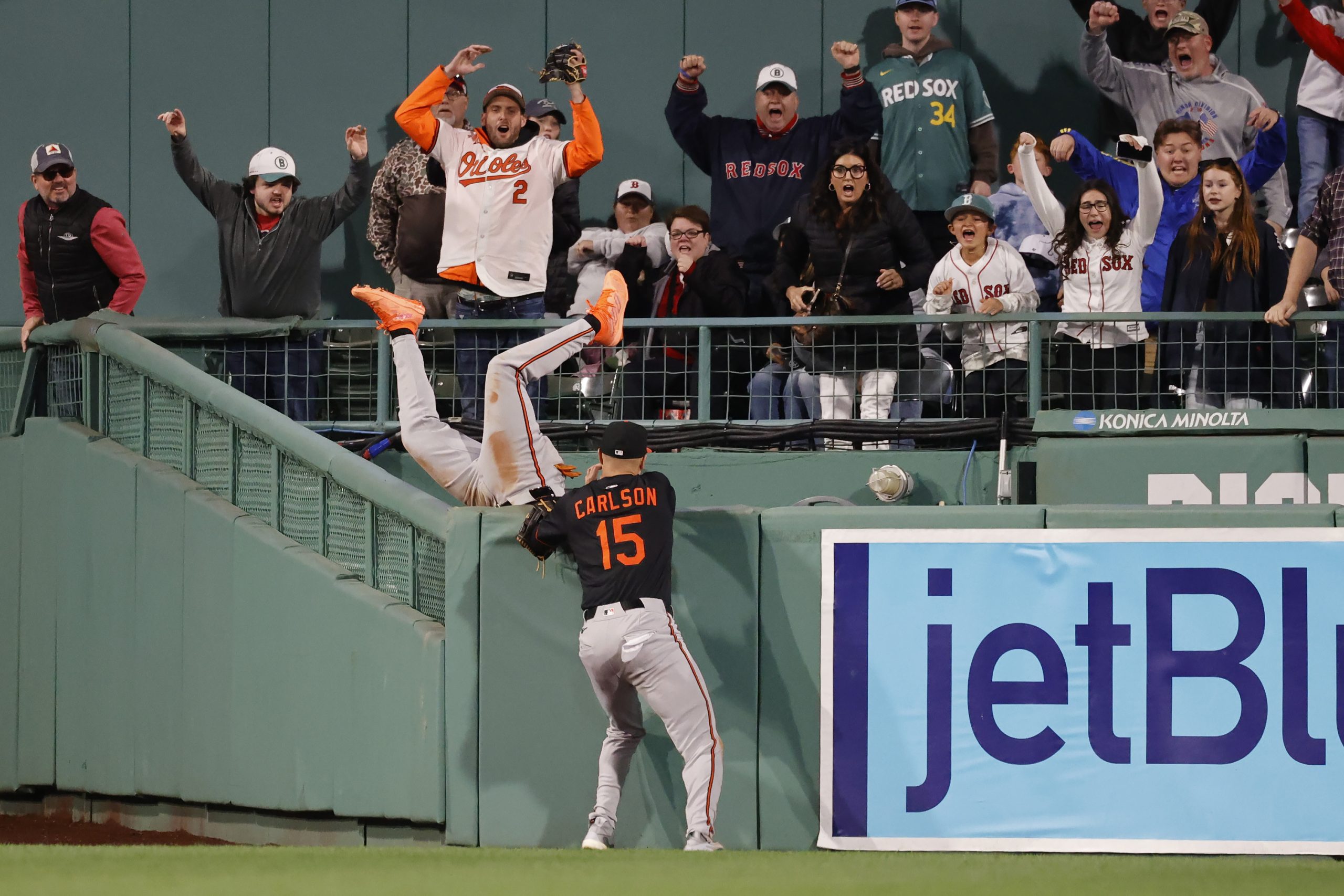 Baltimore Orioles outfielder Jorge Mateo falls into the bullpen unable...
