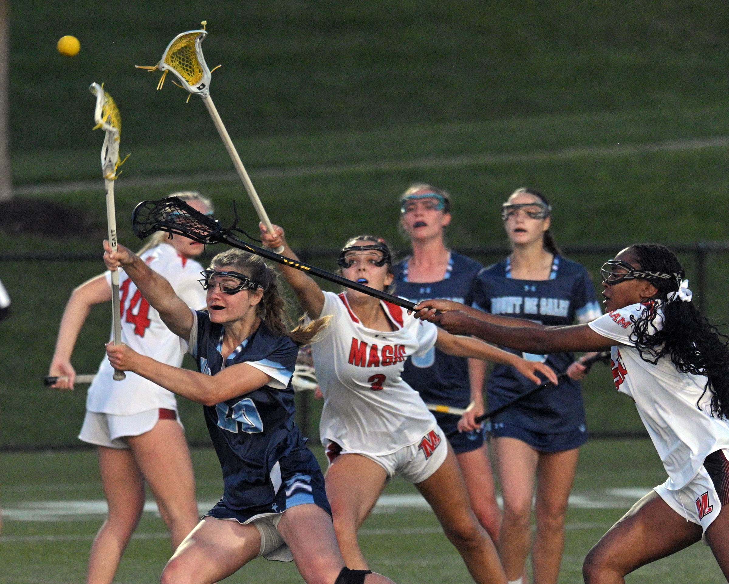 Mount de Sales’ Mackenzie Conley, from left, beats Mercy’s Molly...