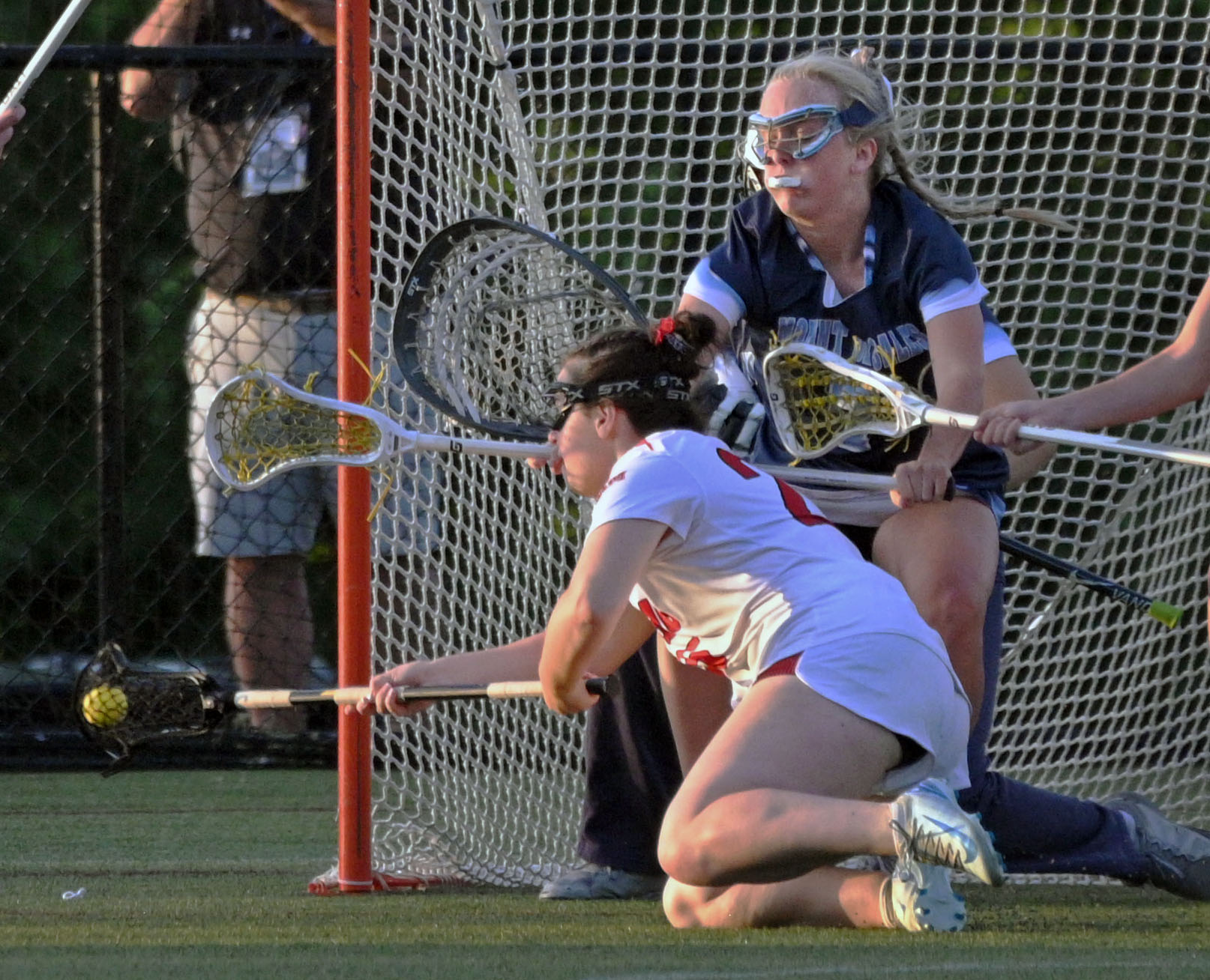 Mercy’s Calleigh Hayes, left, shoots against Mount de Sales’ Alex...