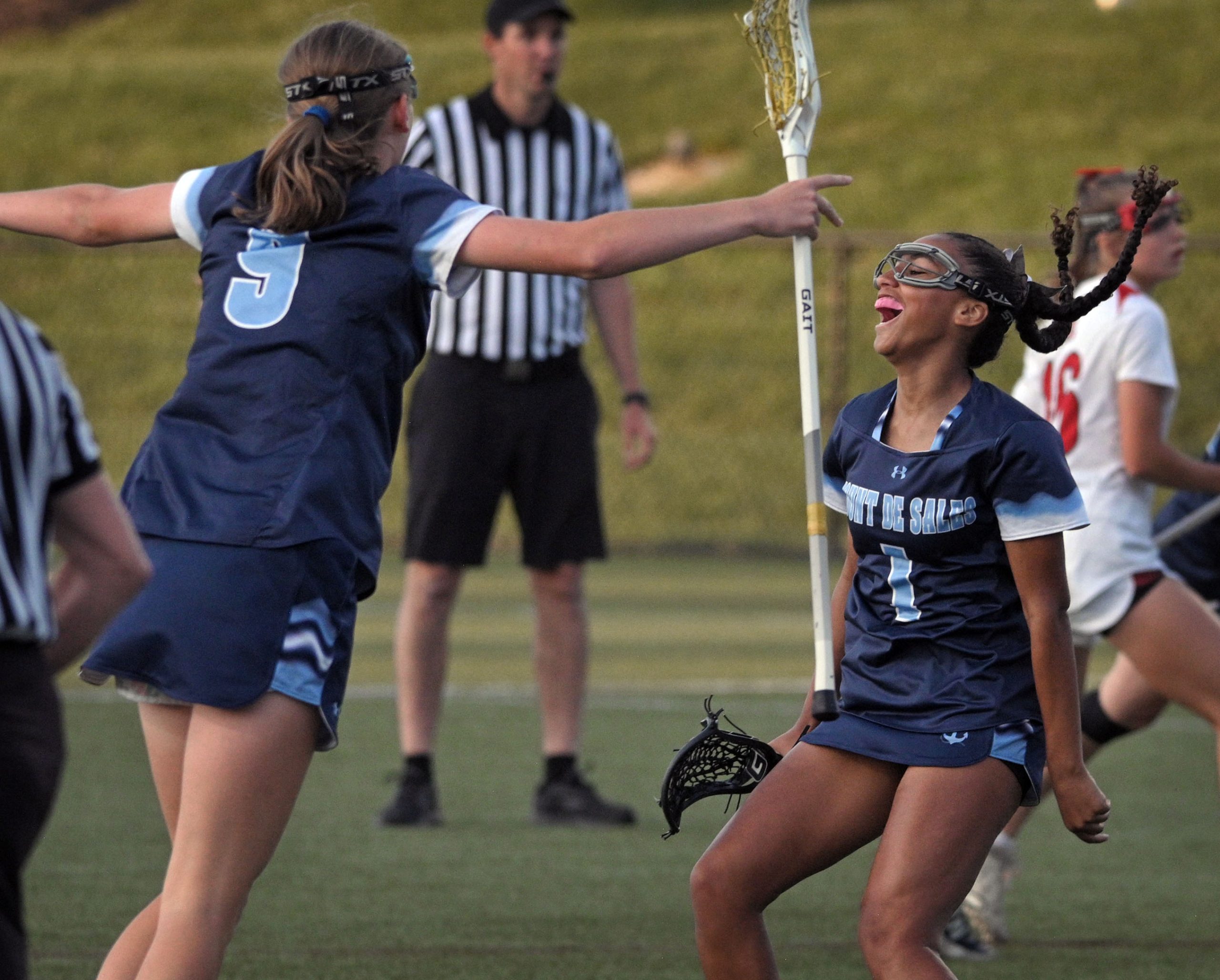 Mount de Sales’ Paige Smith, right, celebrates her goal against...