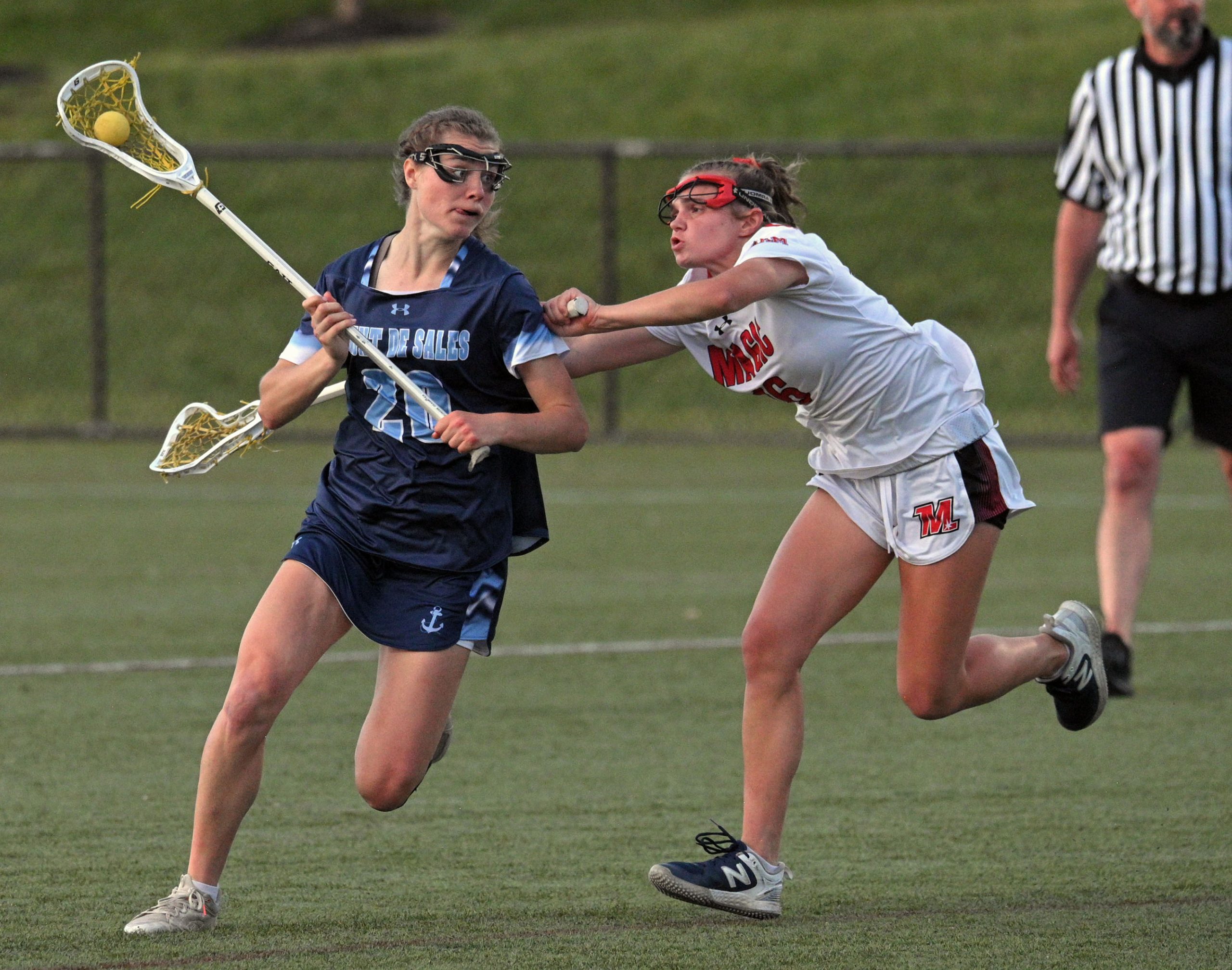 Mercy’s Madeline Hoilman, right, defends against Mount de Sales’ Mackenzie...