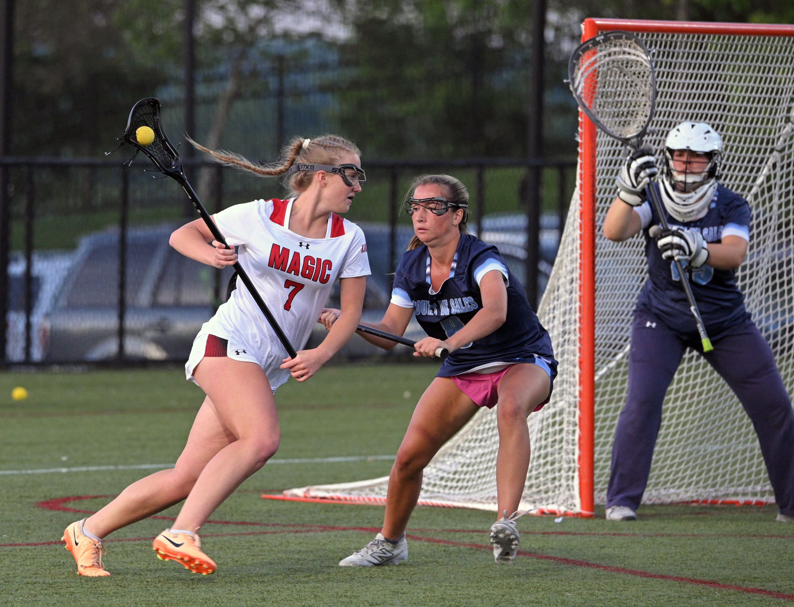 Mercy’s Katelyn Hax, from left, tries to get around Mount...