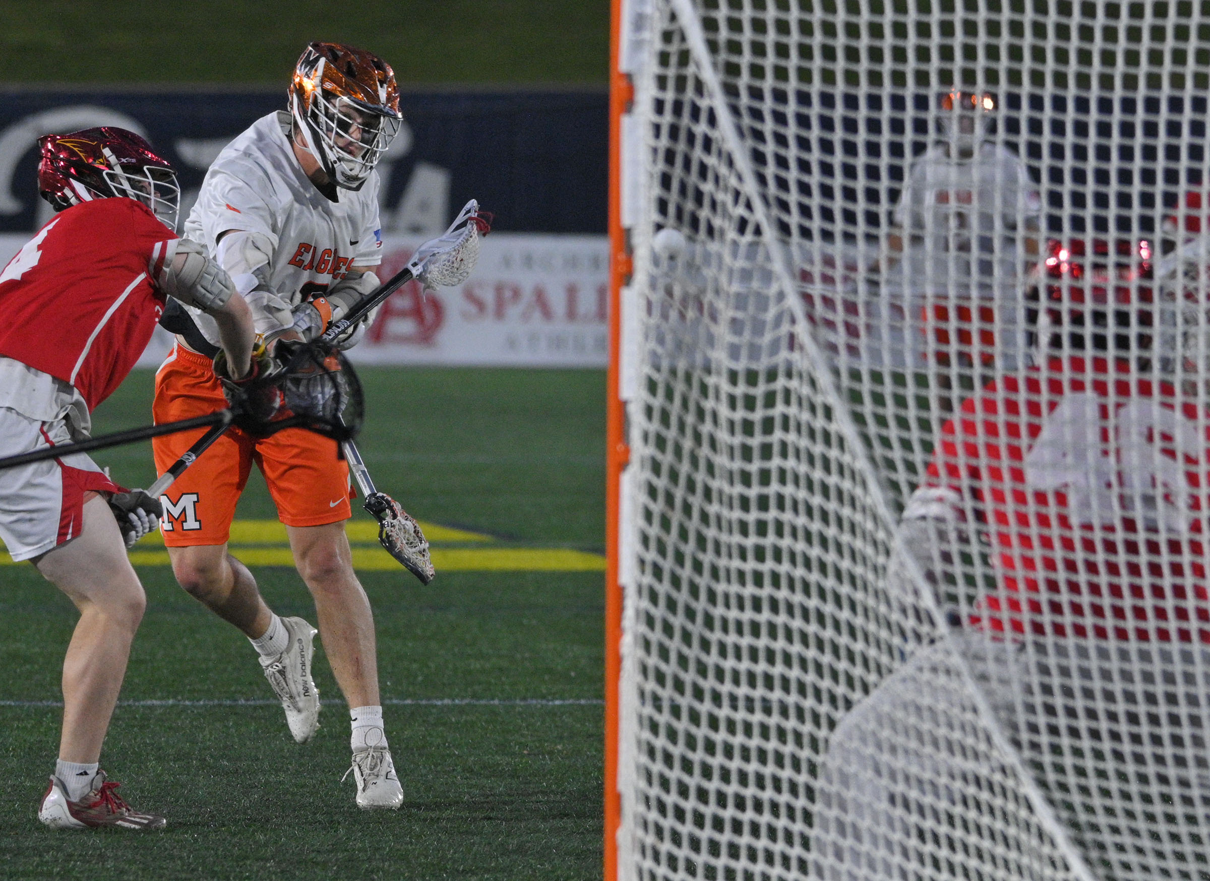 McDonogh’s Brendan Millon, second left, scores against Calvert Hall goalie...