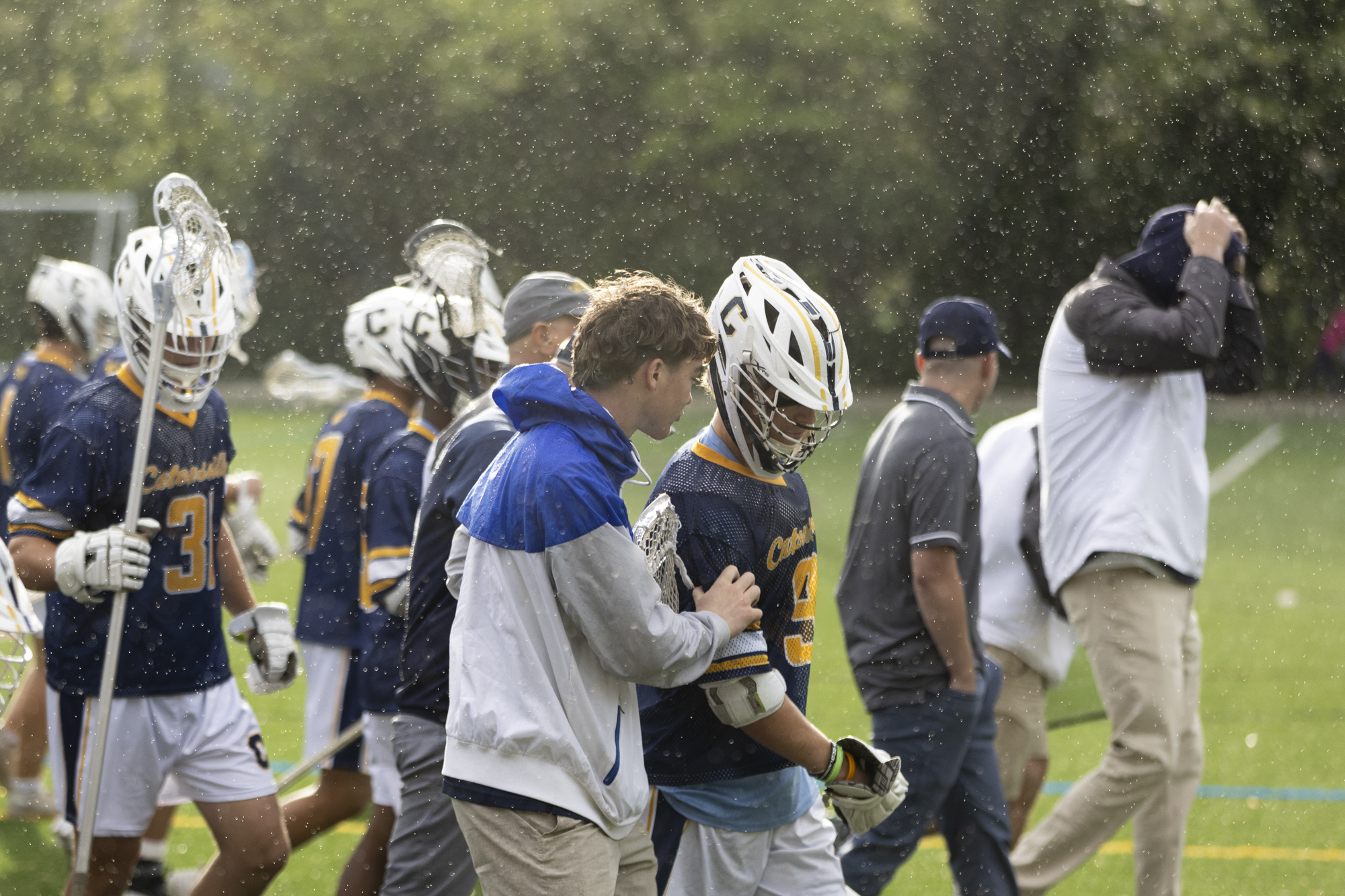 Catonsville Comets walk back to the field after a halftime...