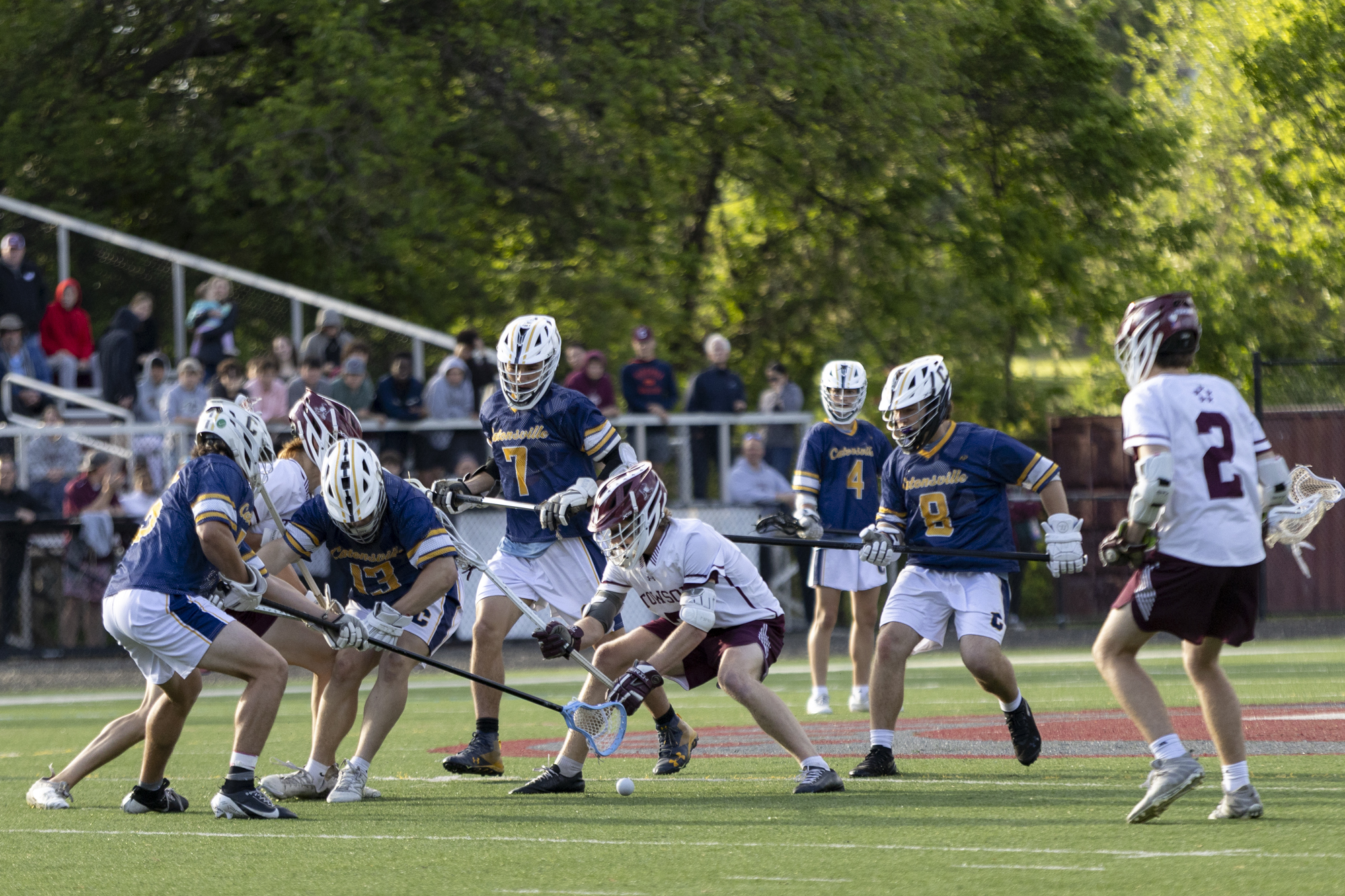 Players fight for possession following the face off during the...