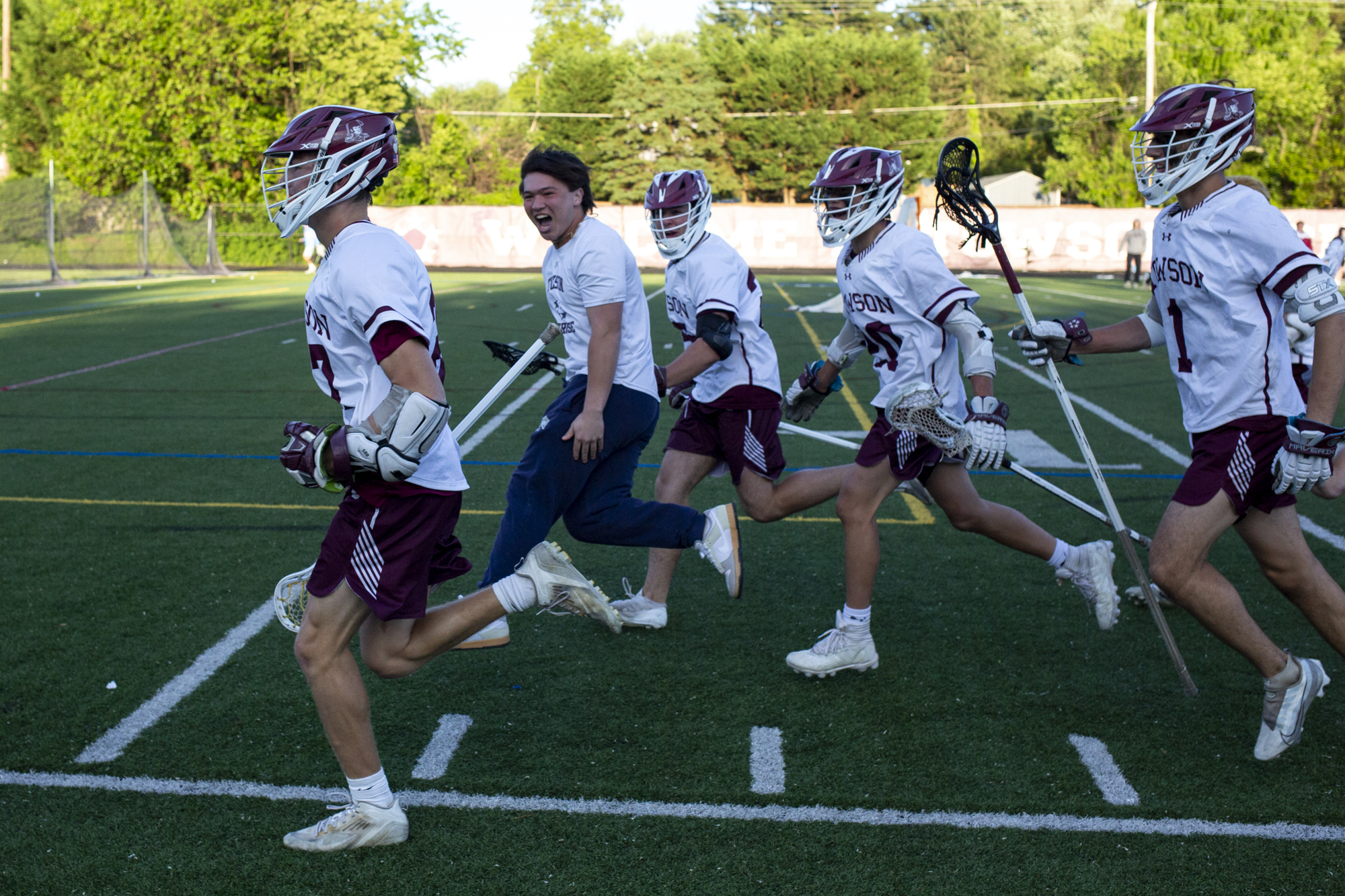 Towson celebrates its 6-5 overtime win over Catonsville in the...