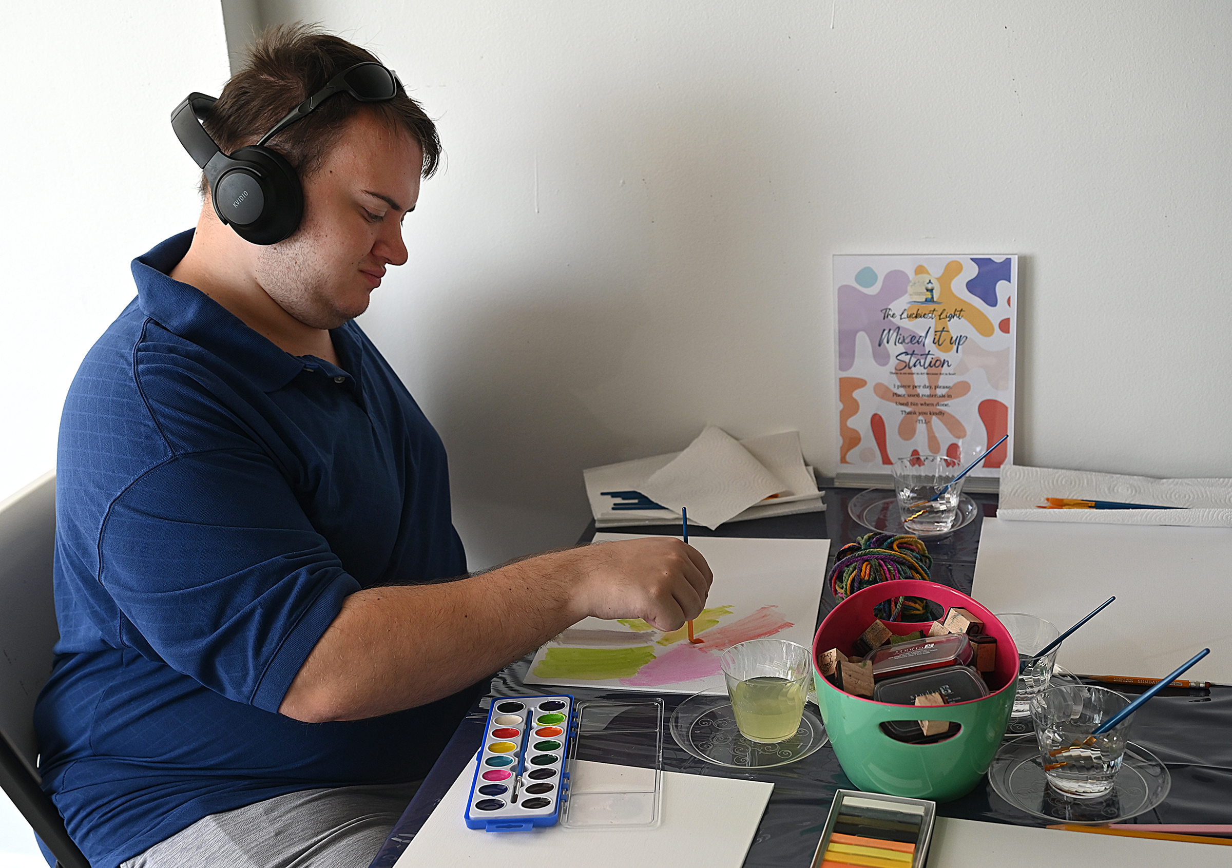 Nicholas Krueger, of Havre de Grace, paints with watercolors at...