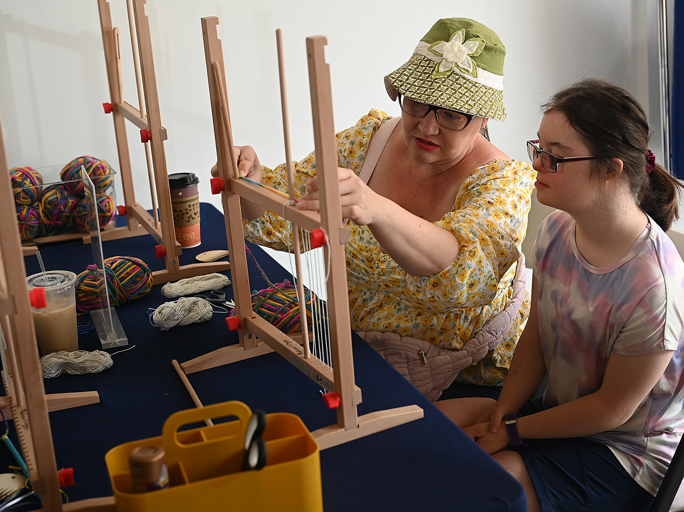 Christy Hinkelman and Anna Sadowski, 17, make art at the...