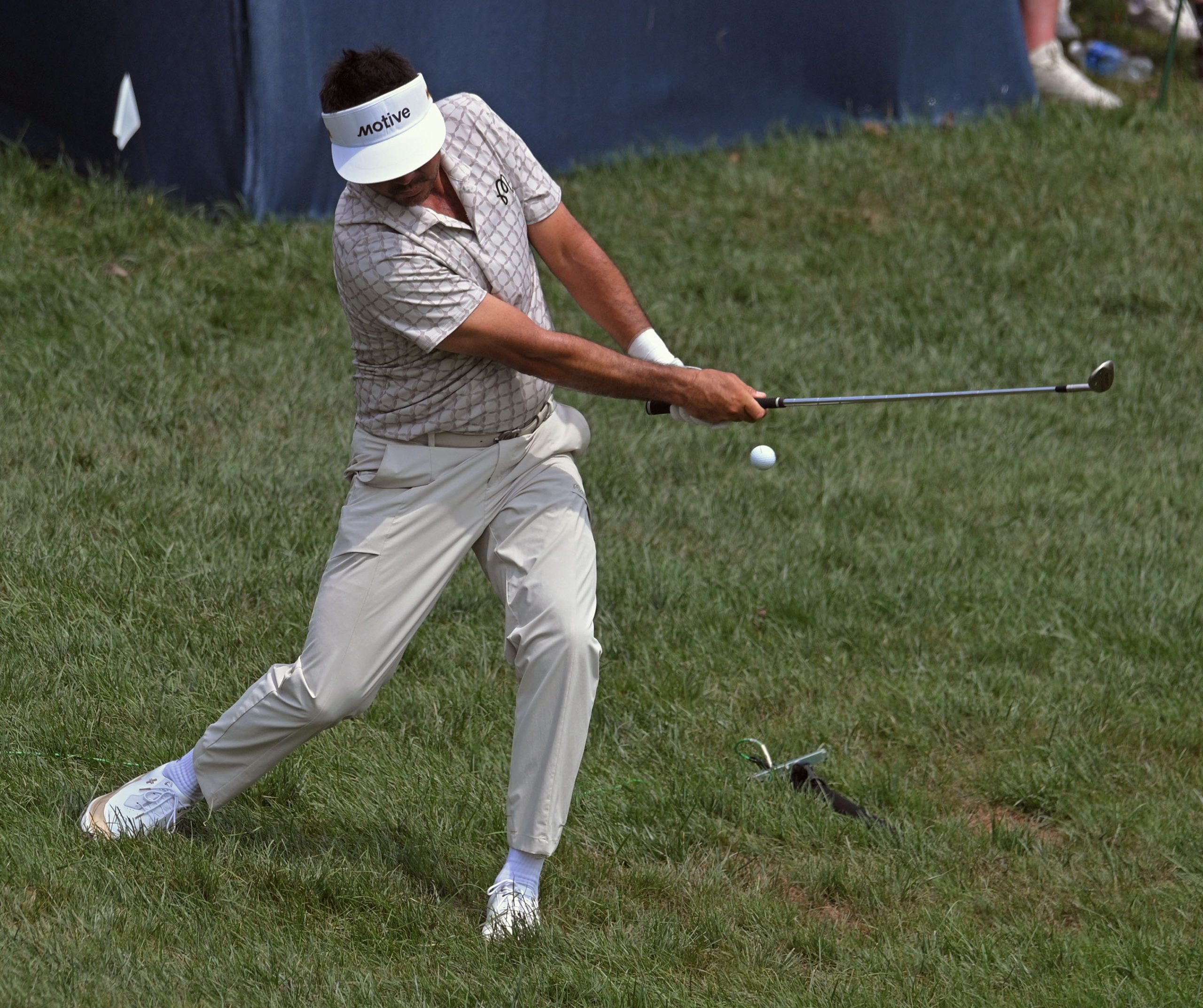 Jason Day chips from the rough for a birdie at...
