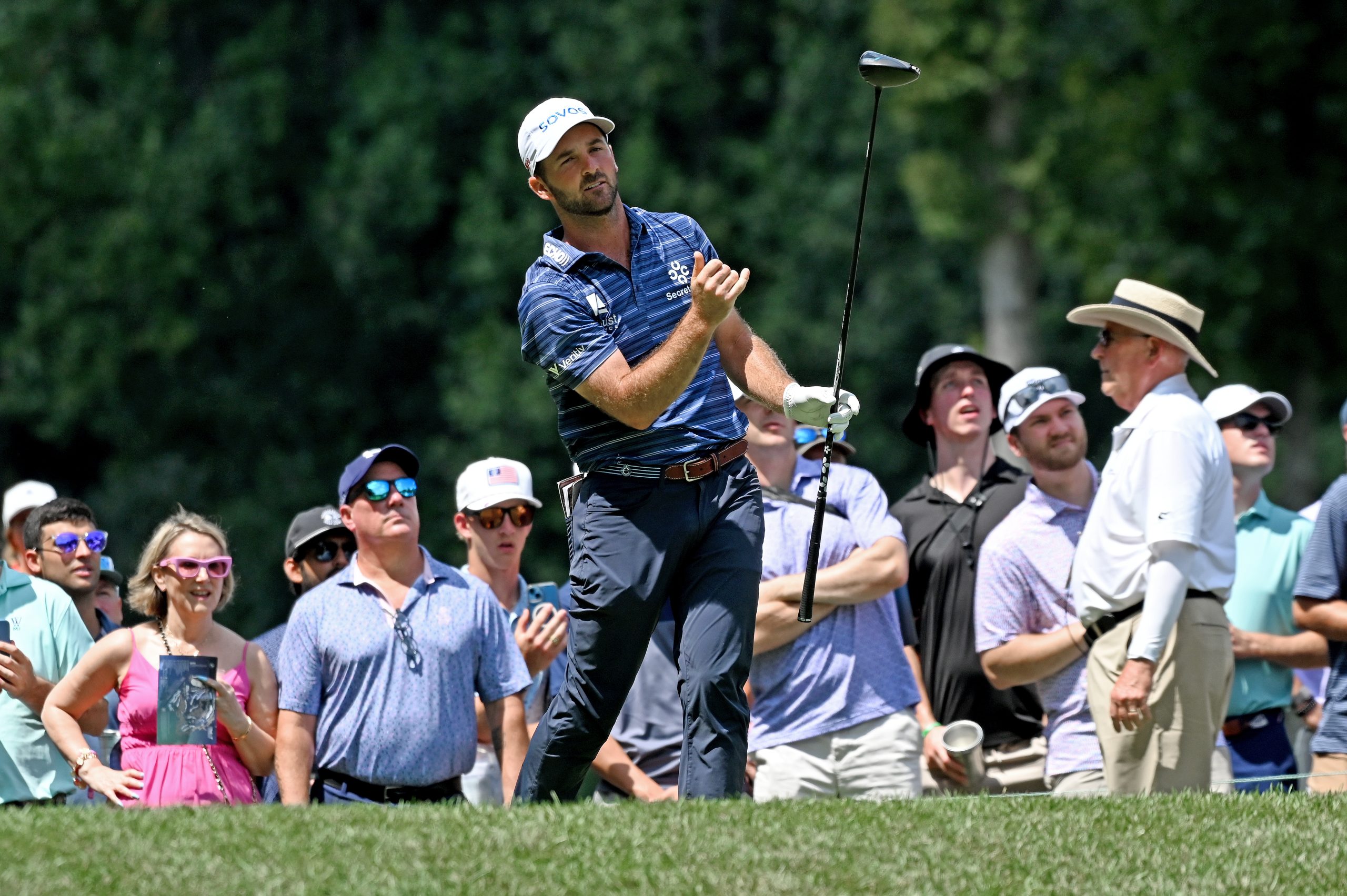 Denny McCarthy of Rockville watches his ball from the teeing...