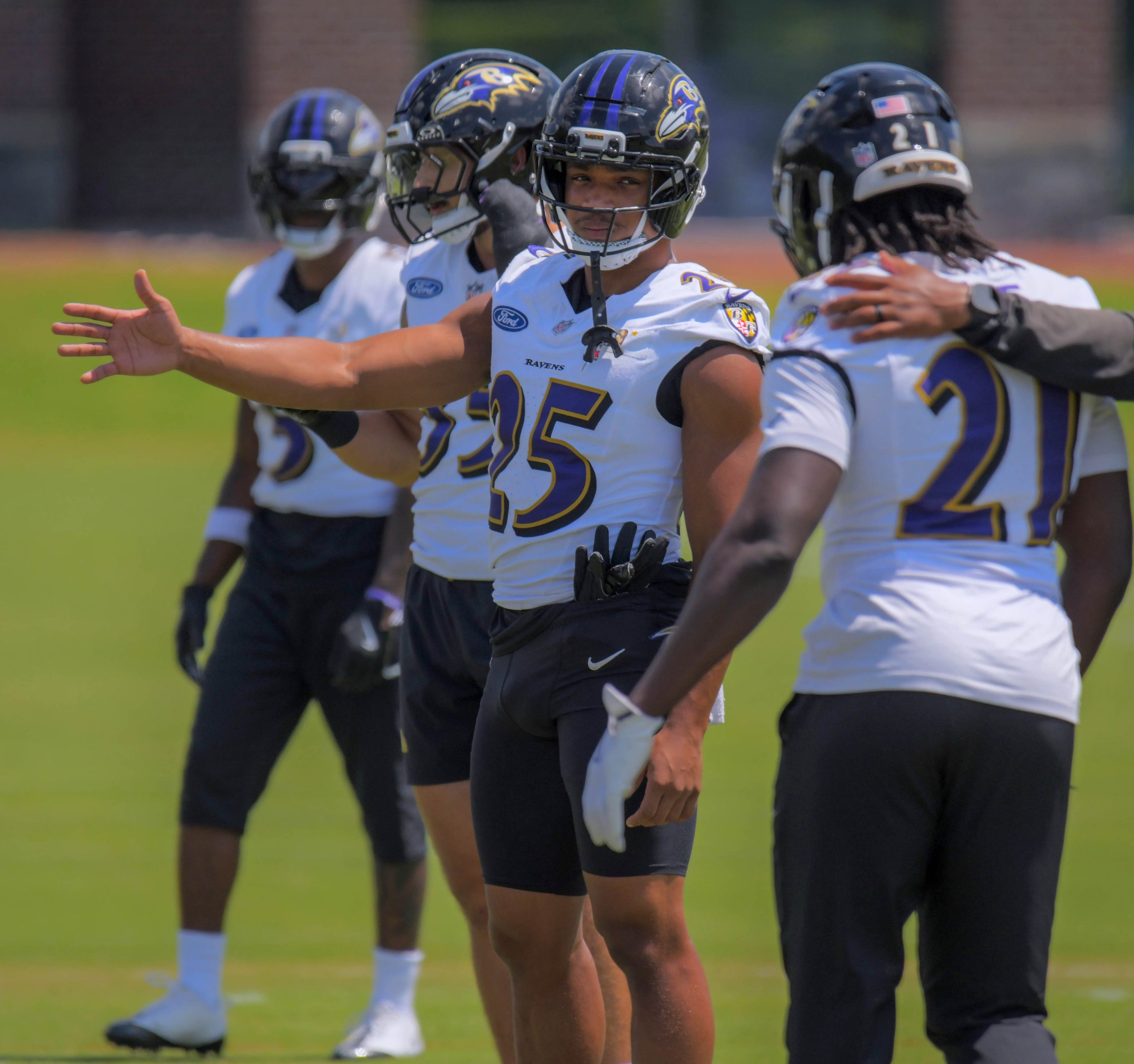 Baltimore Ravens safety Beau Brade gestures toward safety Sanoussi Kane...