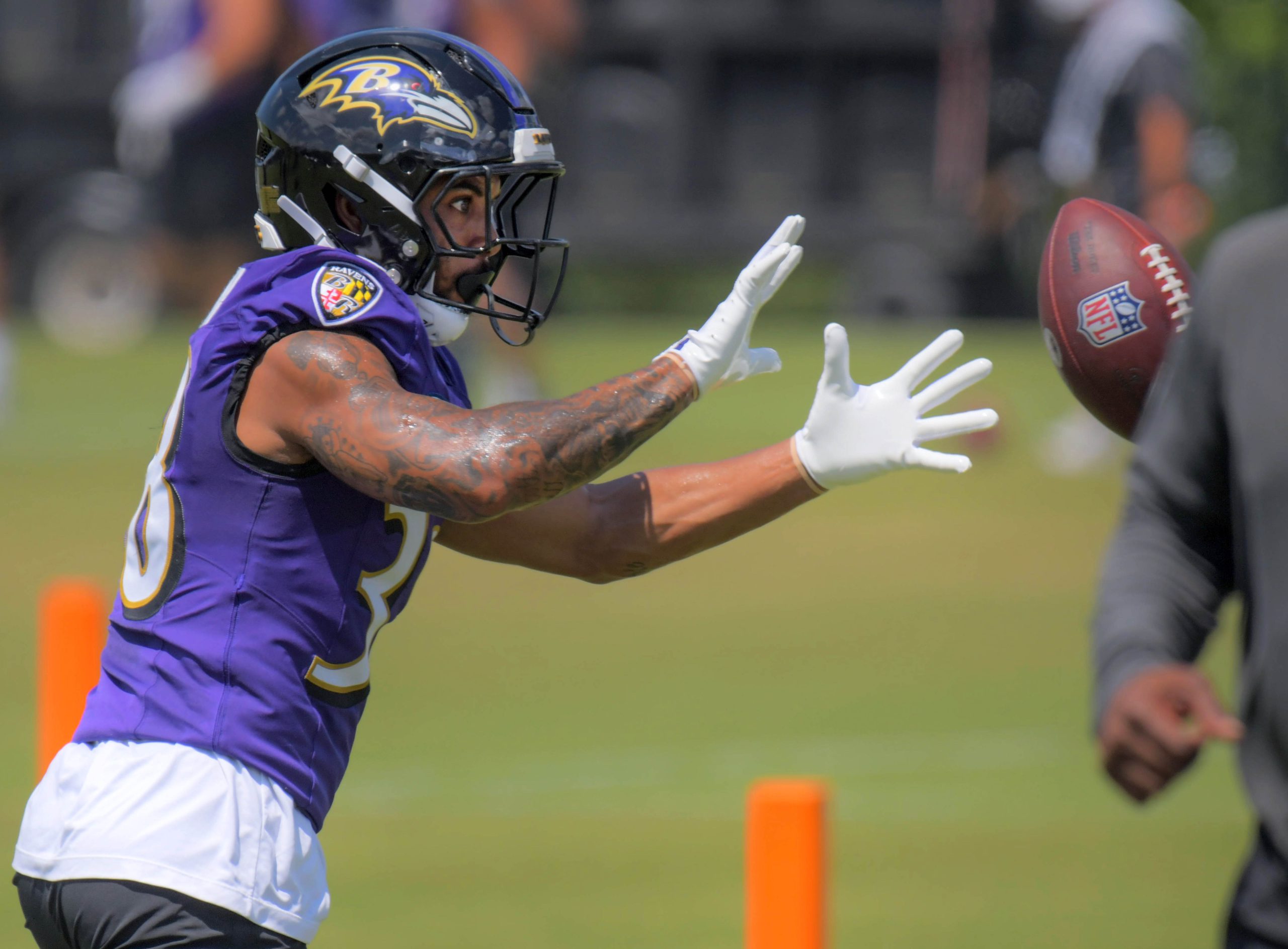 Baltimore Ravens running back Myles Gaskin gets the ball during...