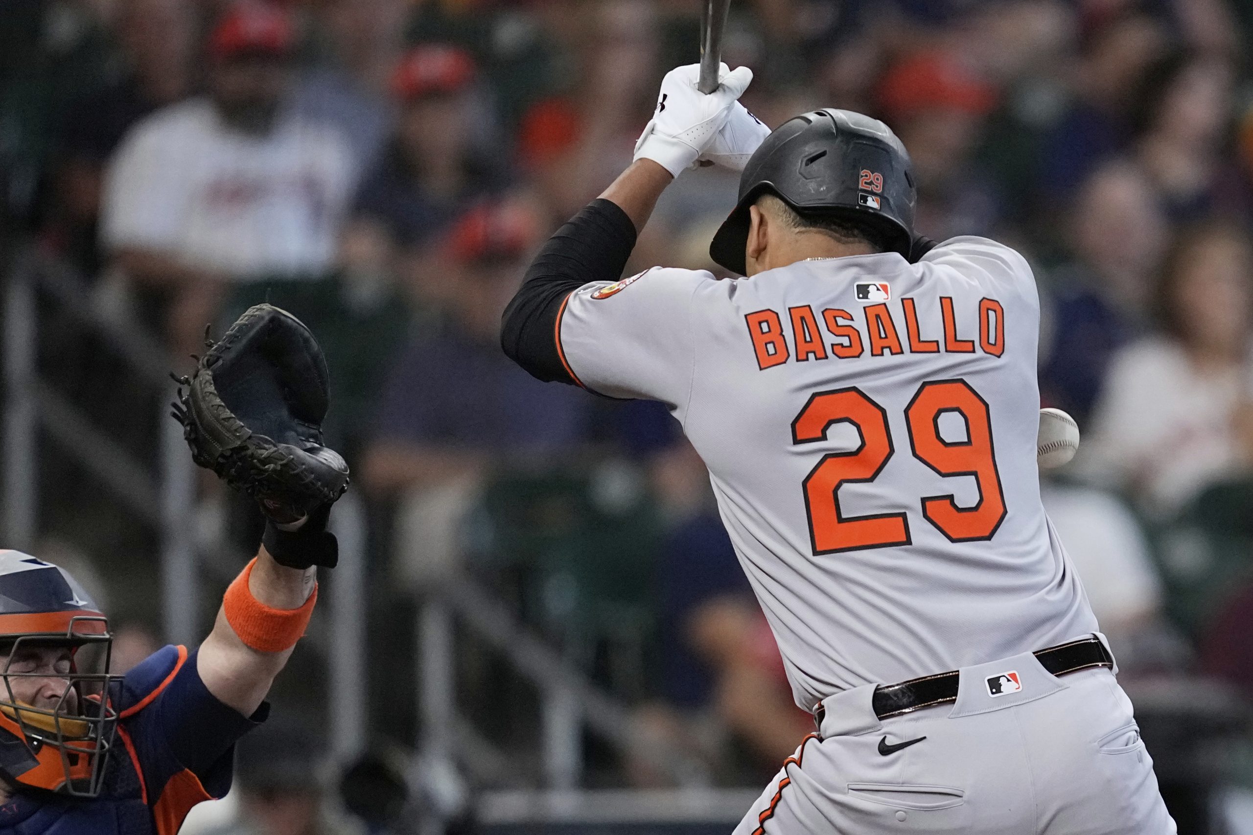 Baltimore Orioles' Samuel Basallo is hit by a pitch thrown...