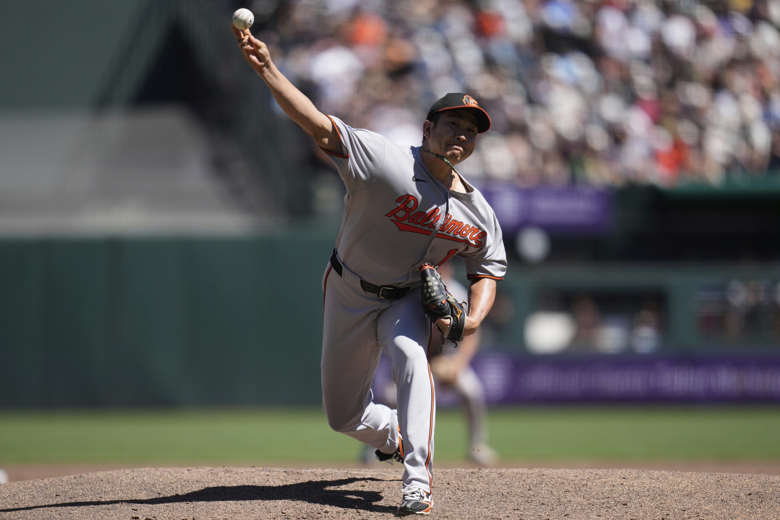 Baltimore Orioles pitcher Tomoyuki Sugano throws against the San Francisco...