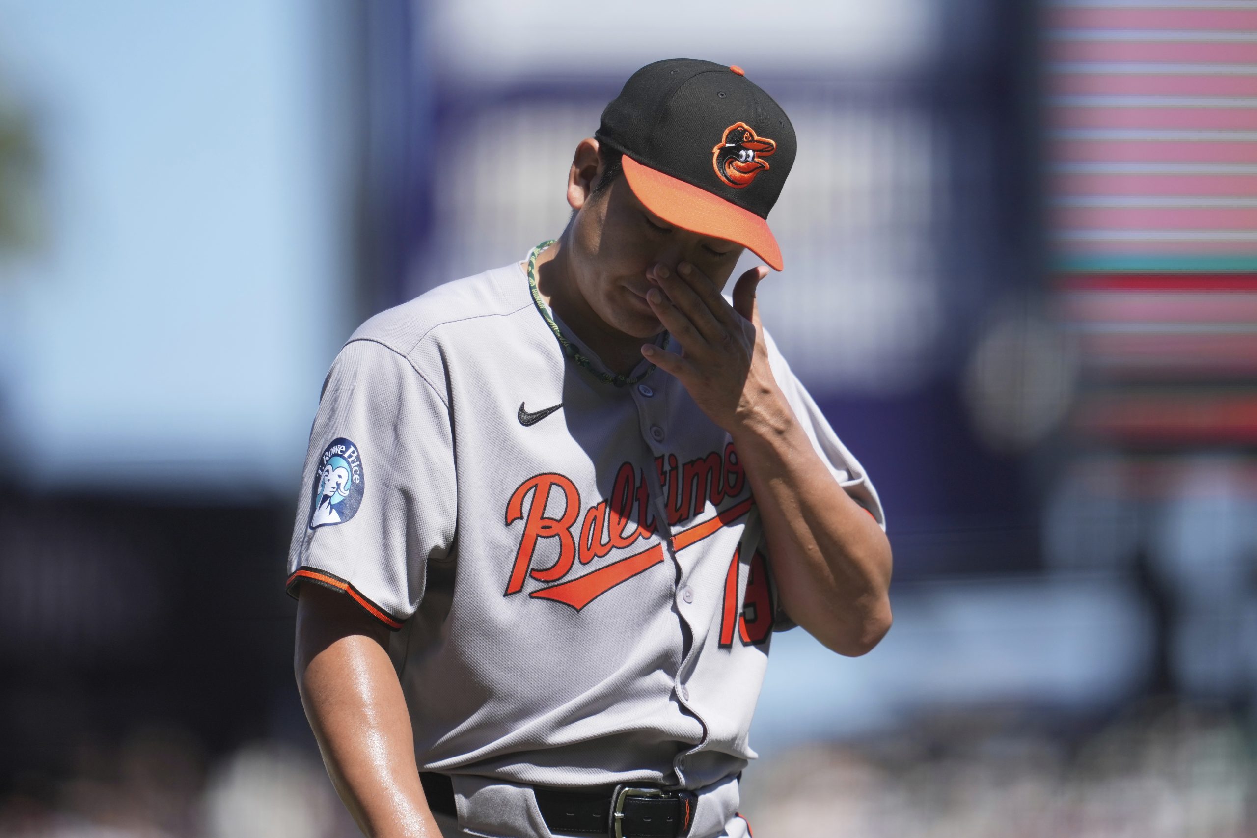 Baltimore Orioles pitcher Tomoyuki Sugano walks to the dugout while...