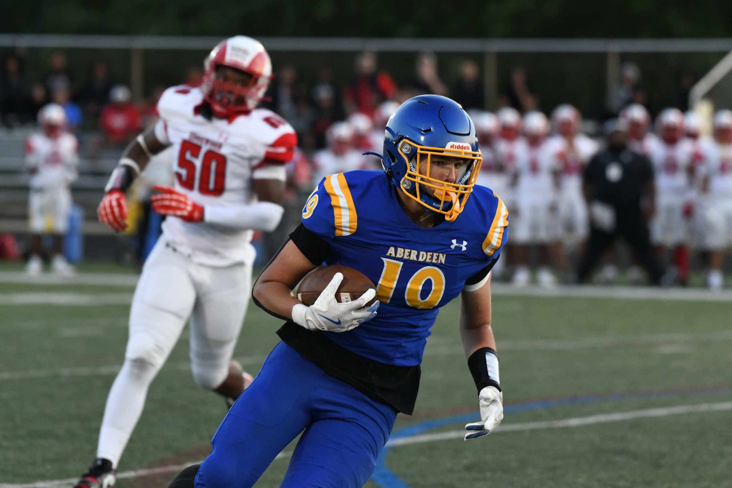 Aberdeen's Mason Holmes looks for first down yardage after making...