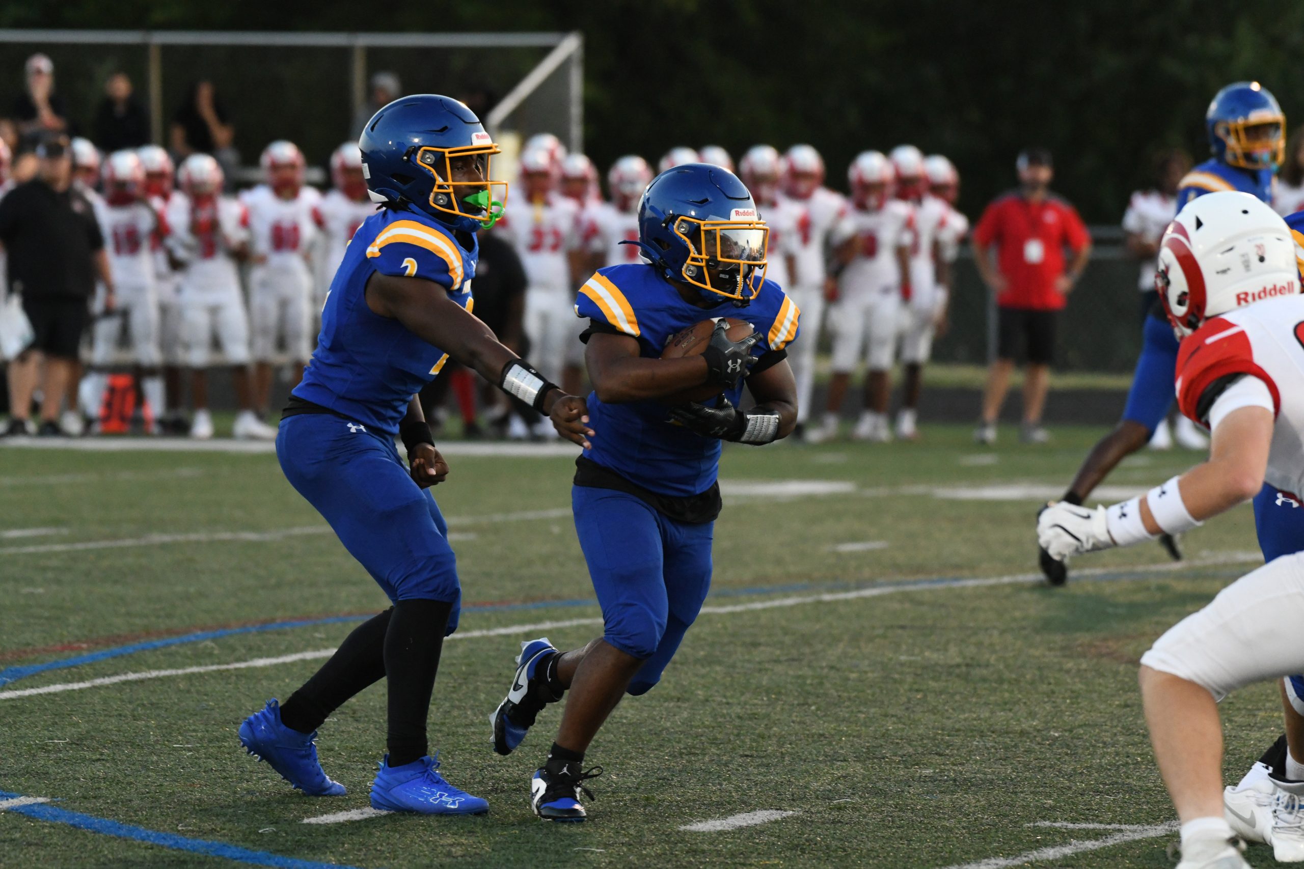 Aberdeen's Anthony Hall takes a handoff from quarterback Collin Rogers...