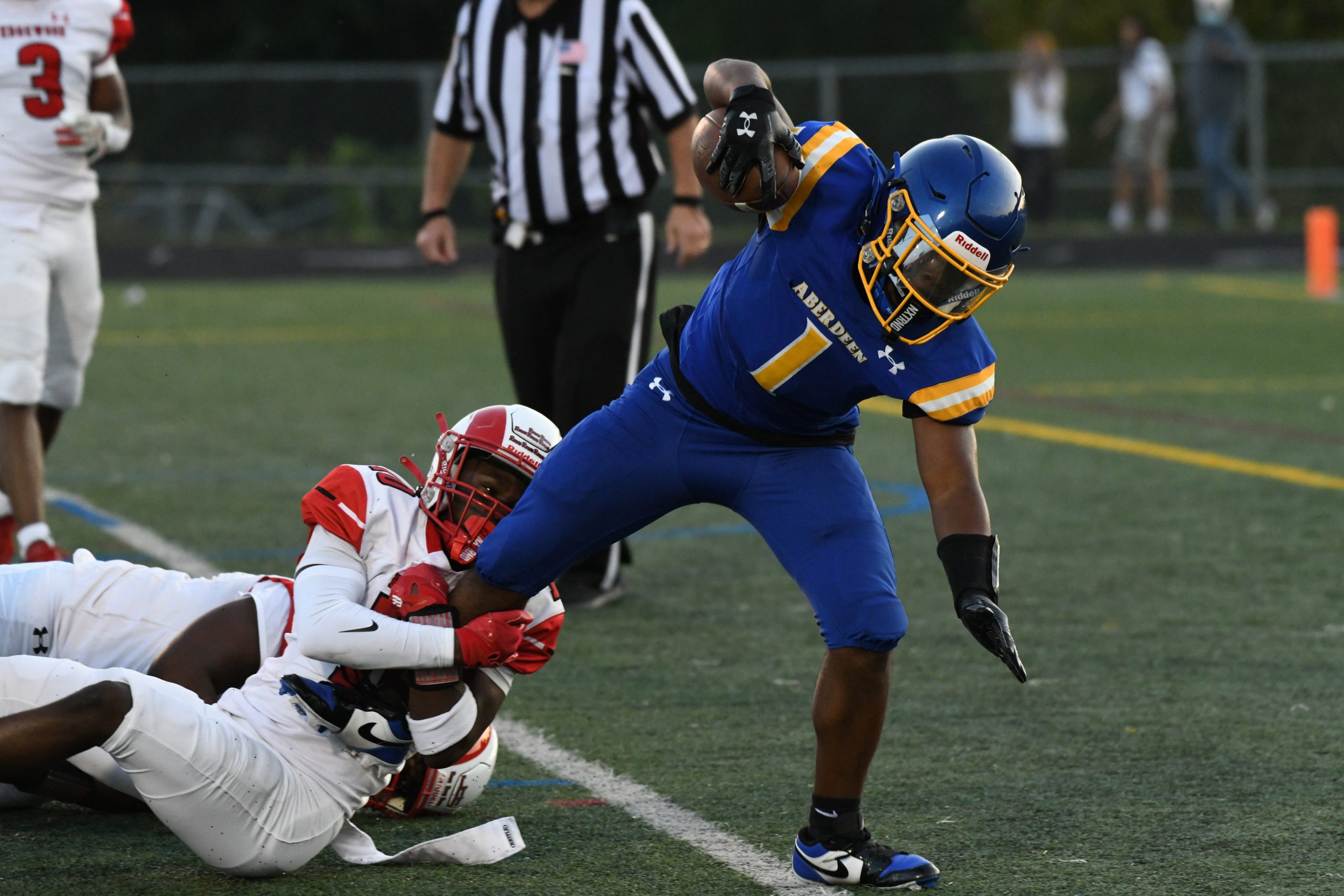 Aberdeen's Anthony Hall extends into the endzone for a touchdown...