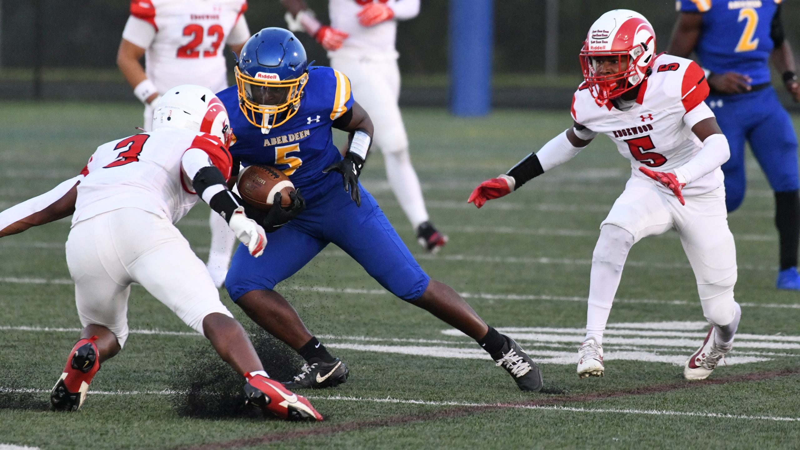 Aberdeen's Cameron Durbin tries to juke away from a tackle...