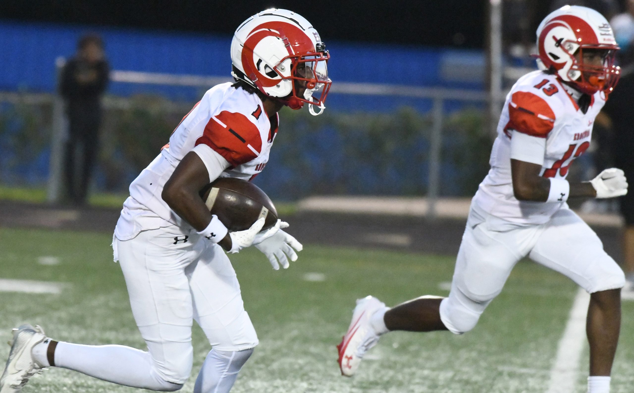 Edgewood's Kyion Greenwood follows a block by teammate Jamin Oriokhi...