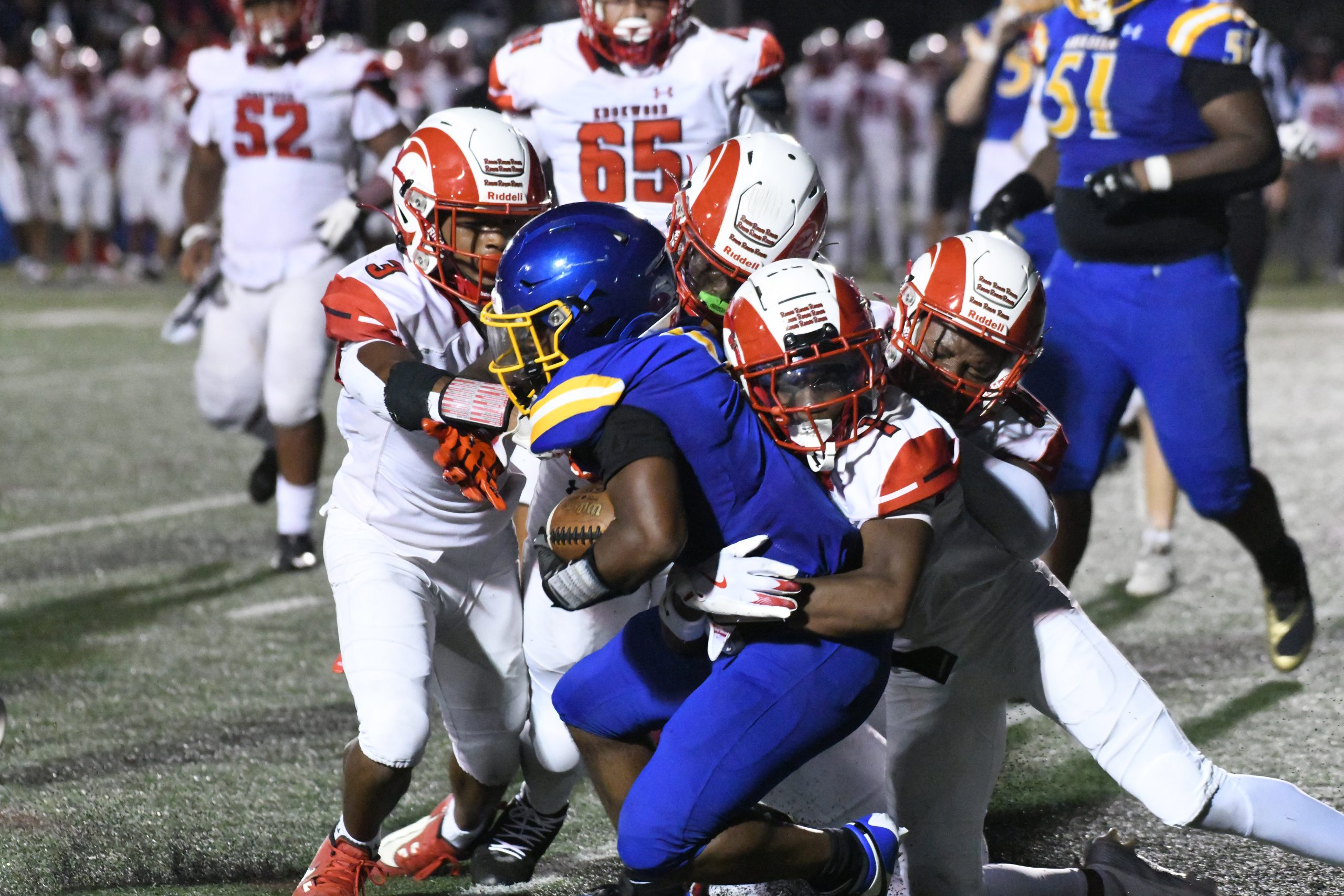 Aberdeen's Anthony Hall is tackled by a foursome of Edgewood...