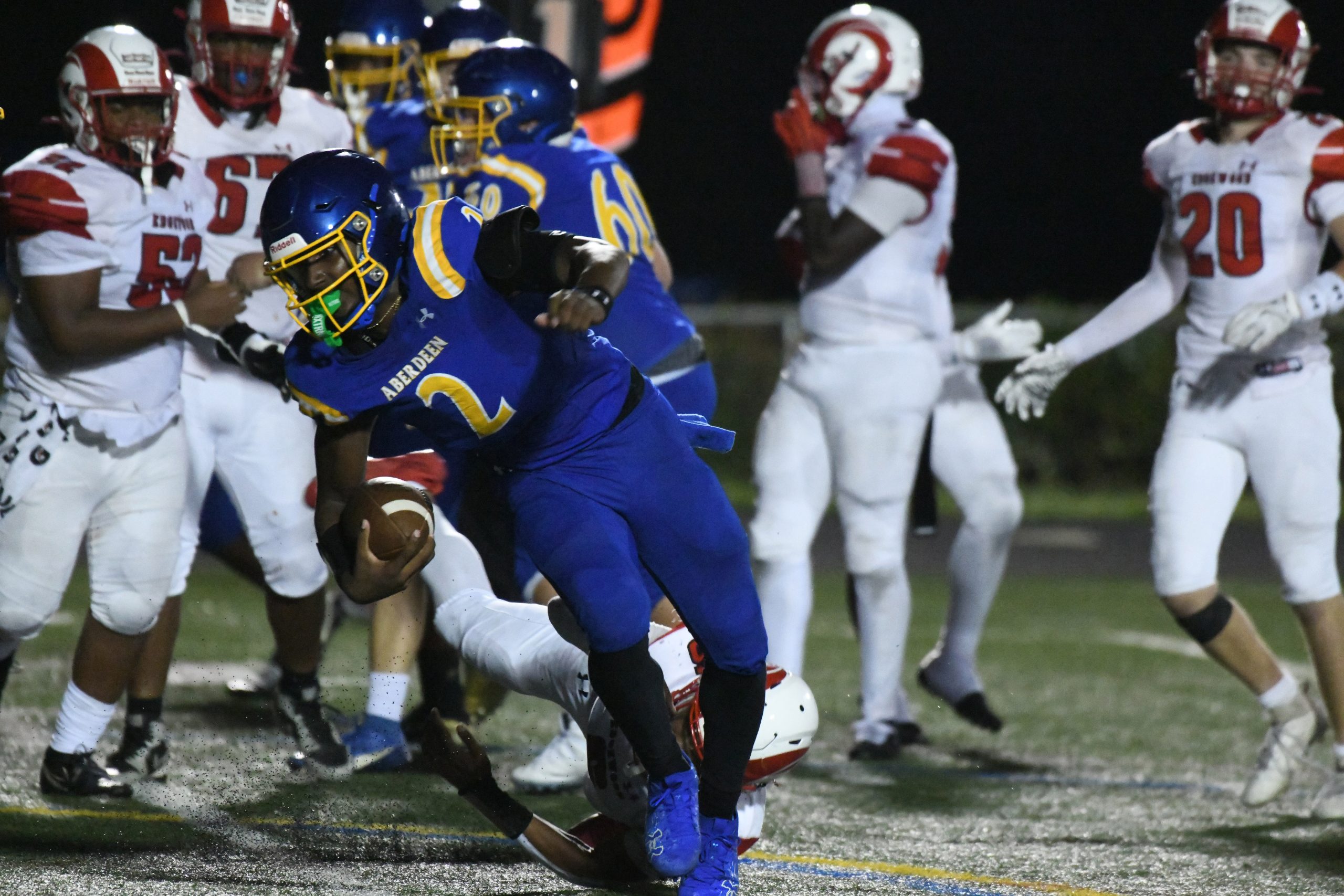 Aberdeen's Collin Rogers avoids an Edgewood defender as he tries...