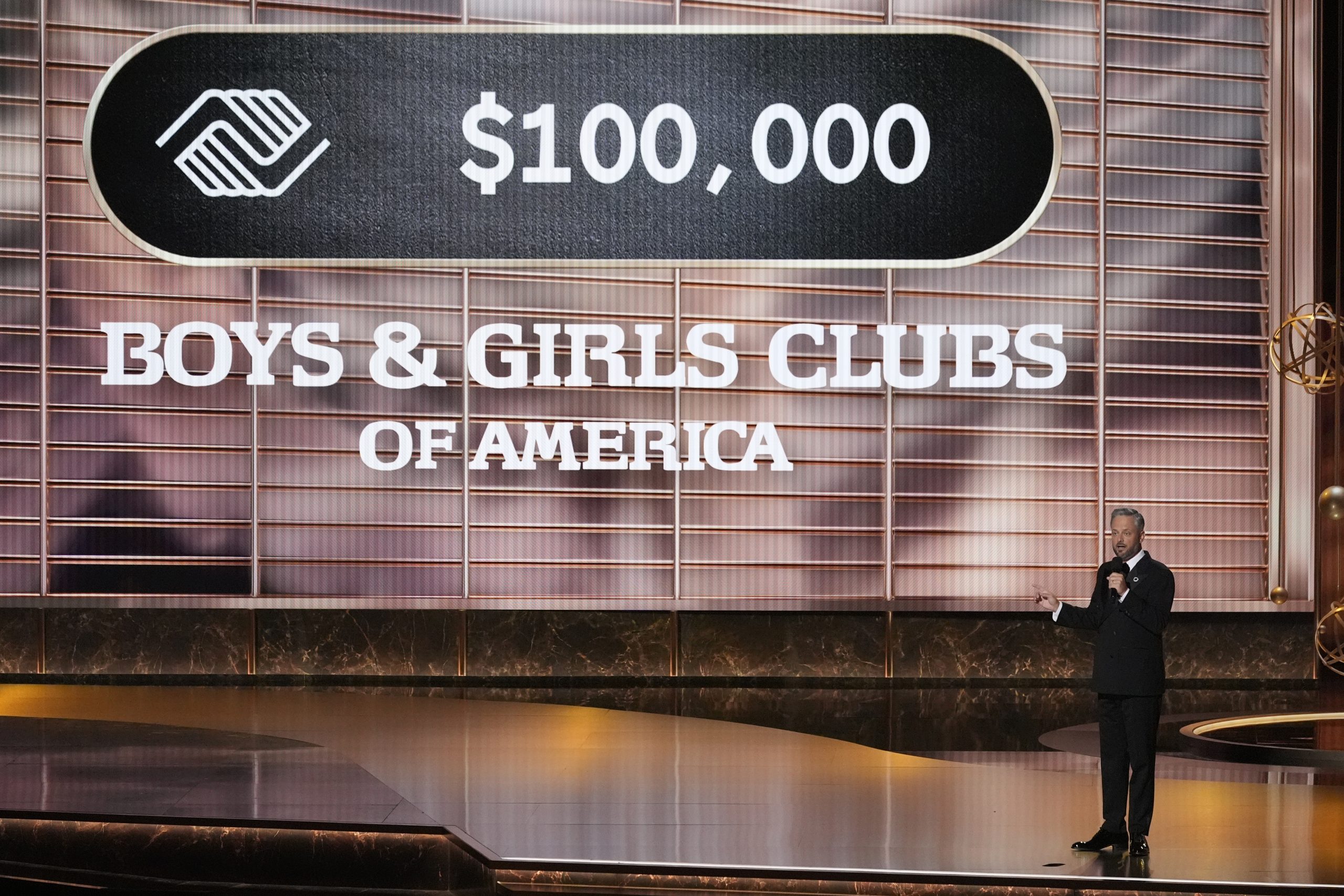 Host Nate Bargatze pleges a donation during the 77th Primetime...
