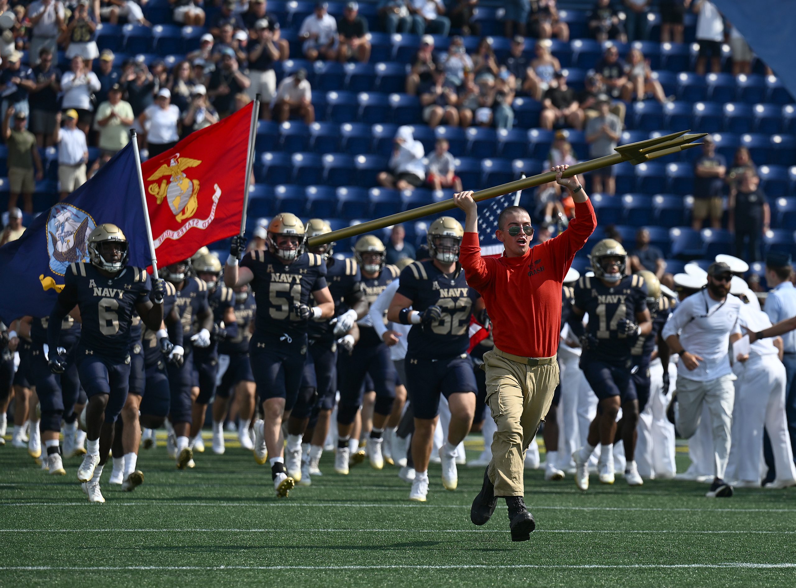 Navy takes the field. The Navy Midshipmen host the University...