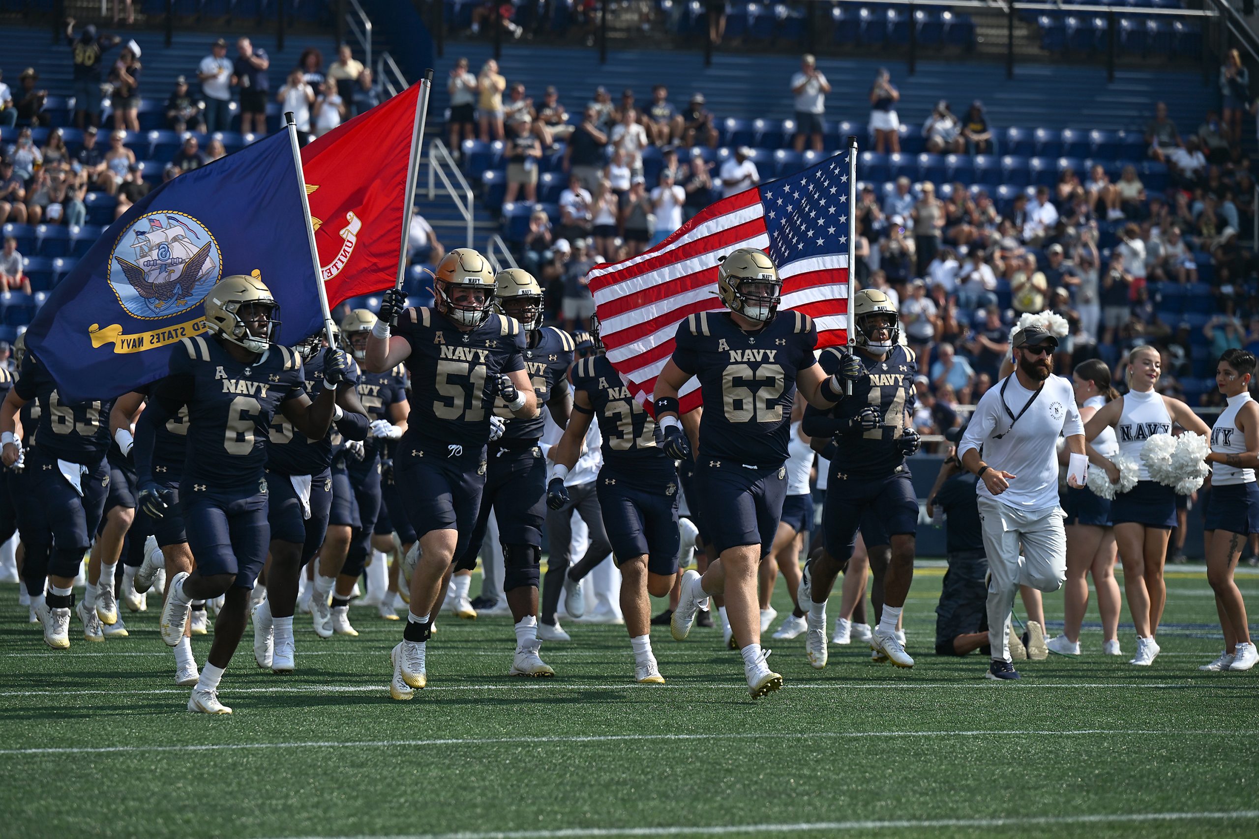 Navy takes the field. The Navy Midshipmen host the University...