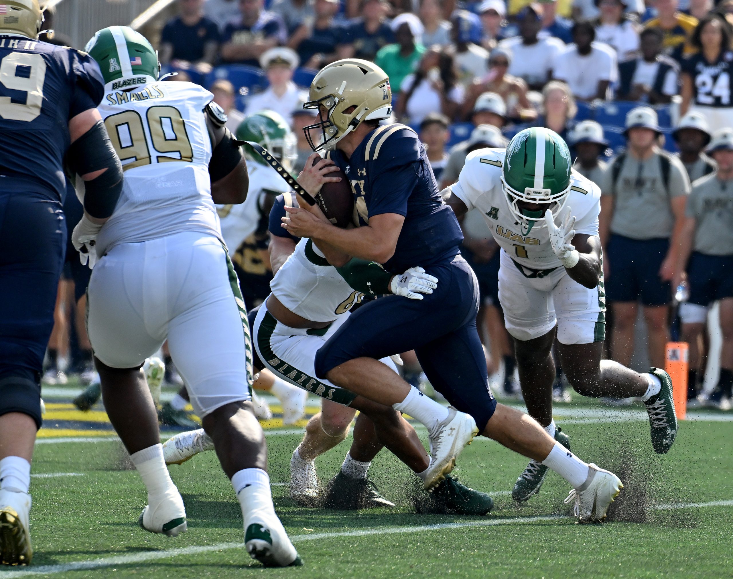 Navy quarterback Blake Horvath runs the ball in the first...