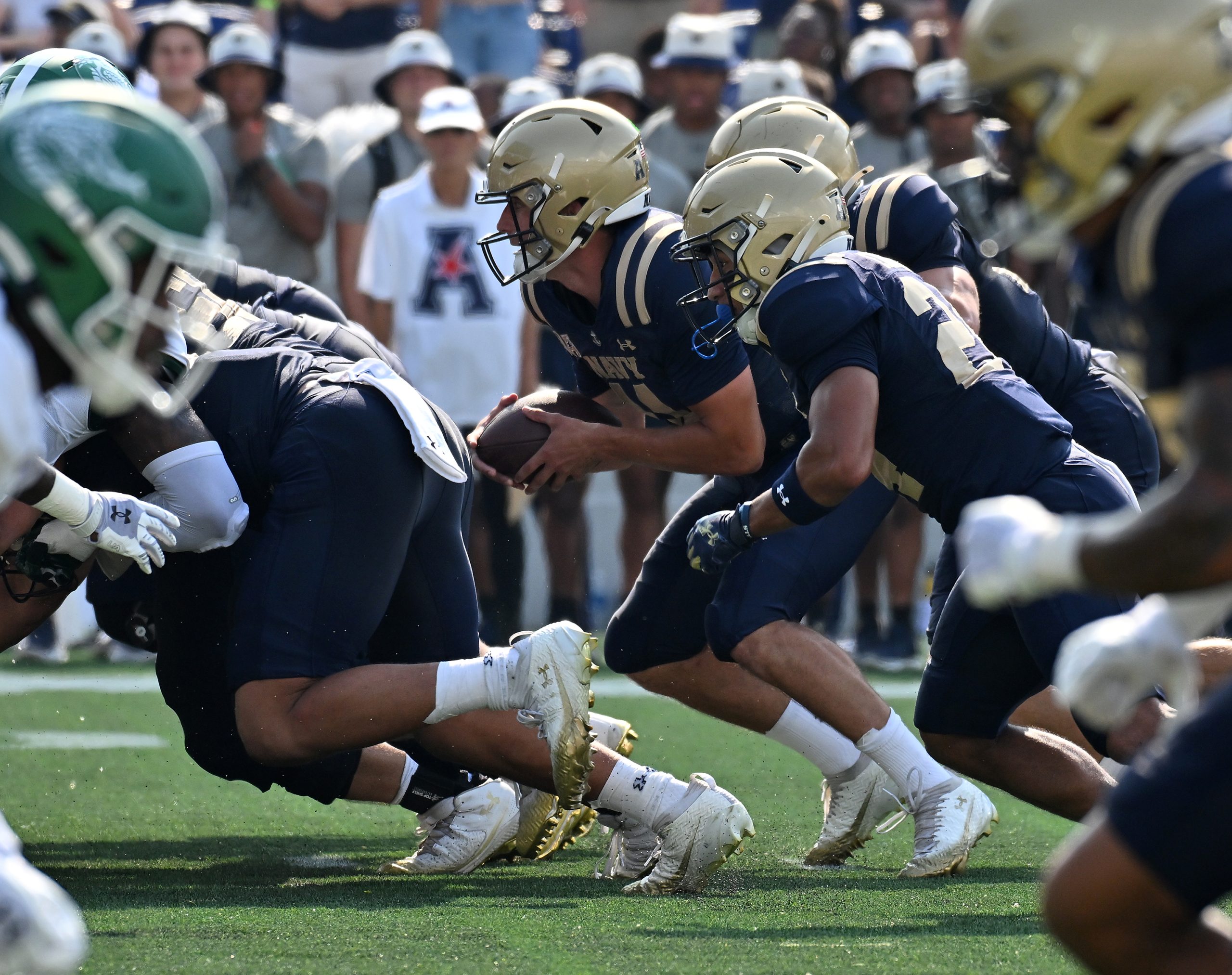 Navy quarterback Blake Horvath runs the ball in for a...