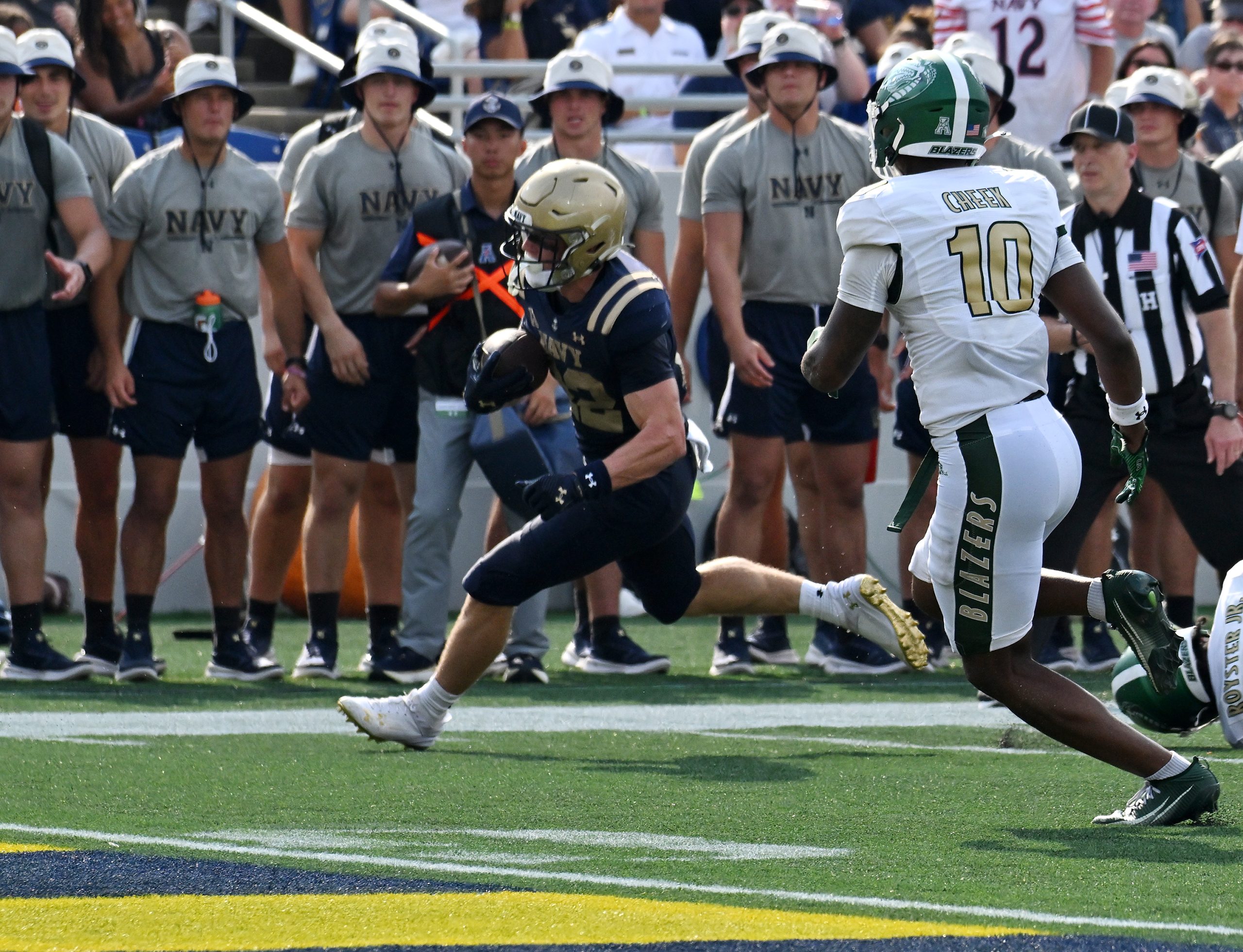 Navy’s Eli Heidenreich runs in for a touchdown in the...
