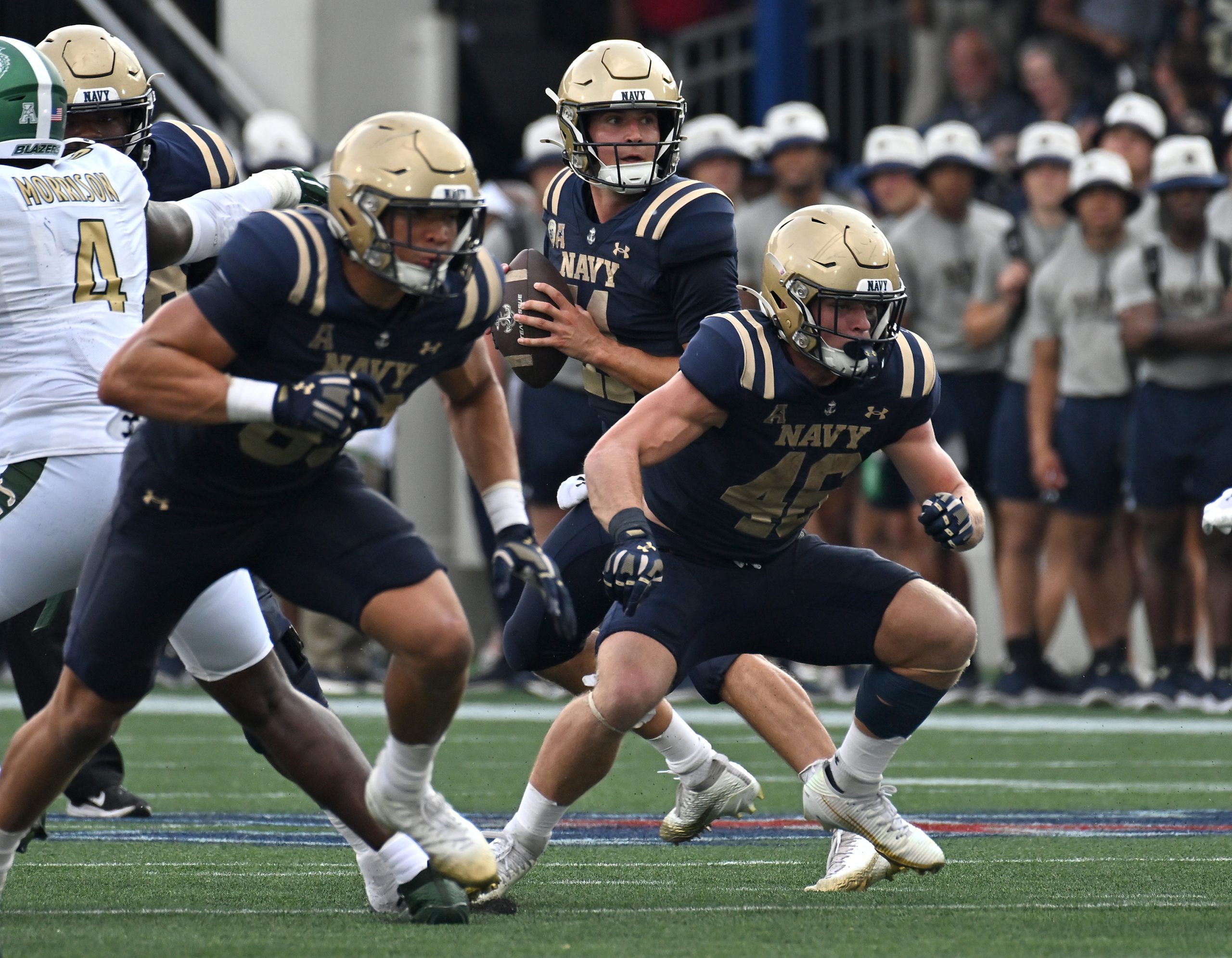 Navy quarterback Blake Horvath throws a touchdown pass to Luke...
