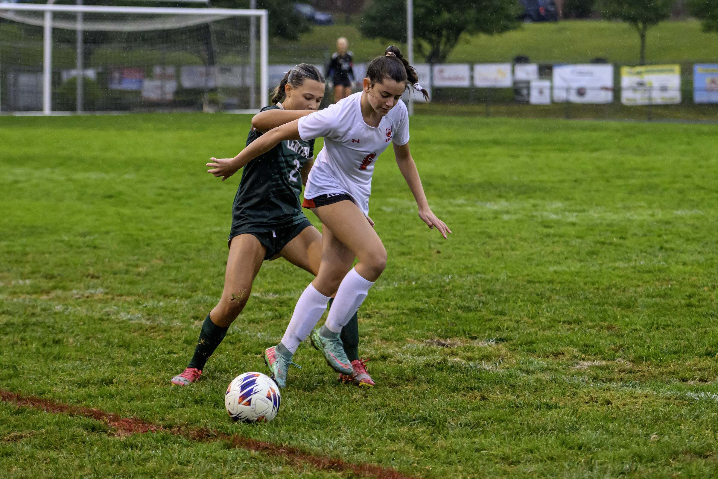 Roland Park's Brooklyn Glick dribbles in front of Century's Makenna...