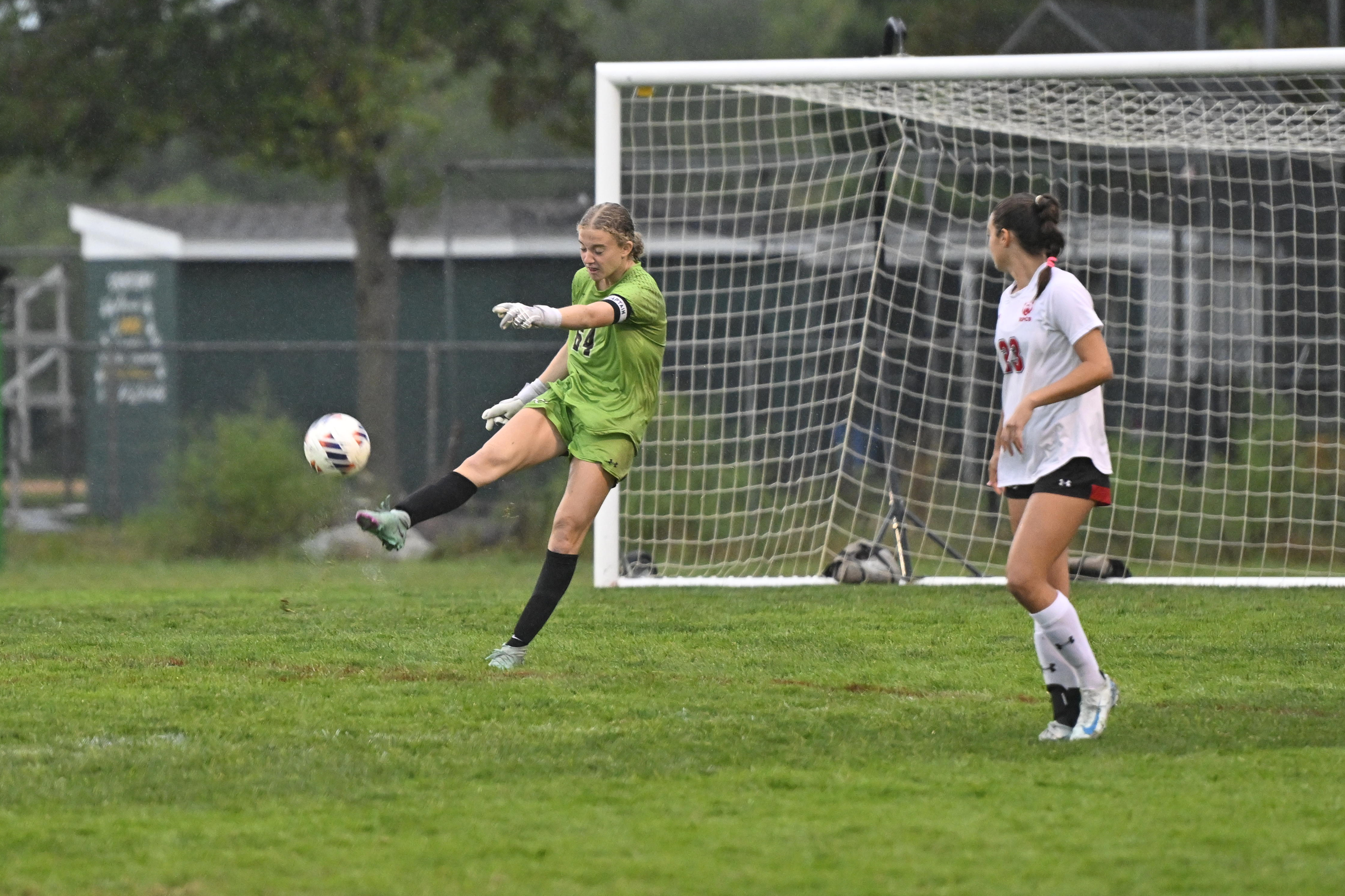 Roland Park goalie Avery Mason punts the ball during a...