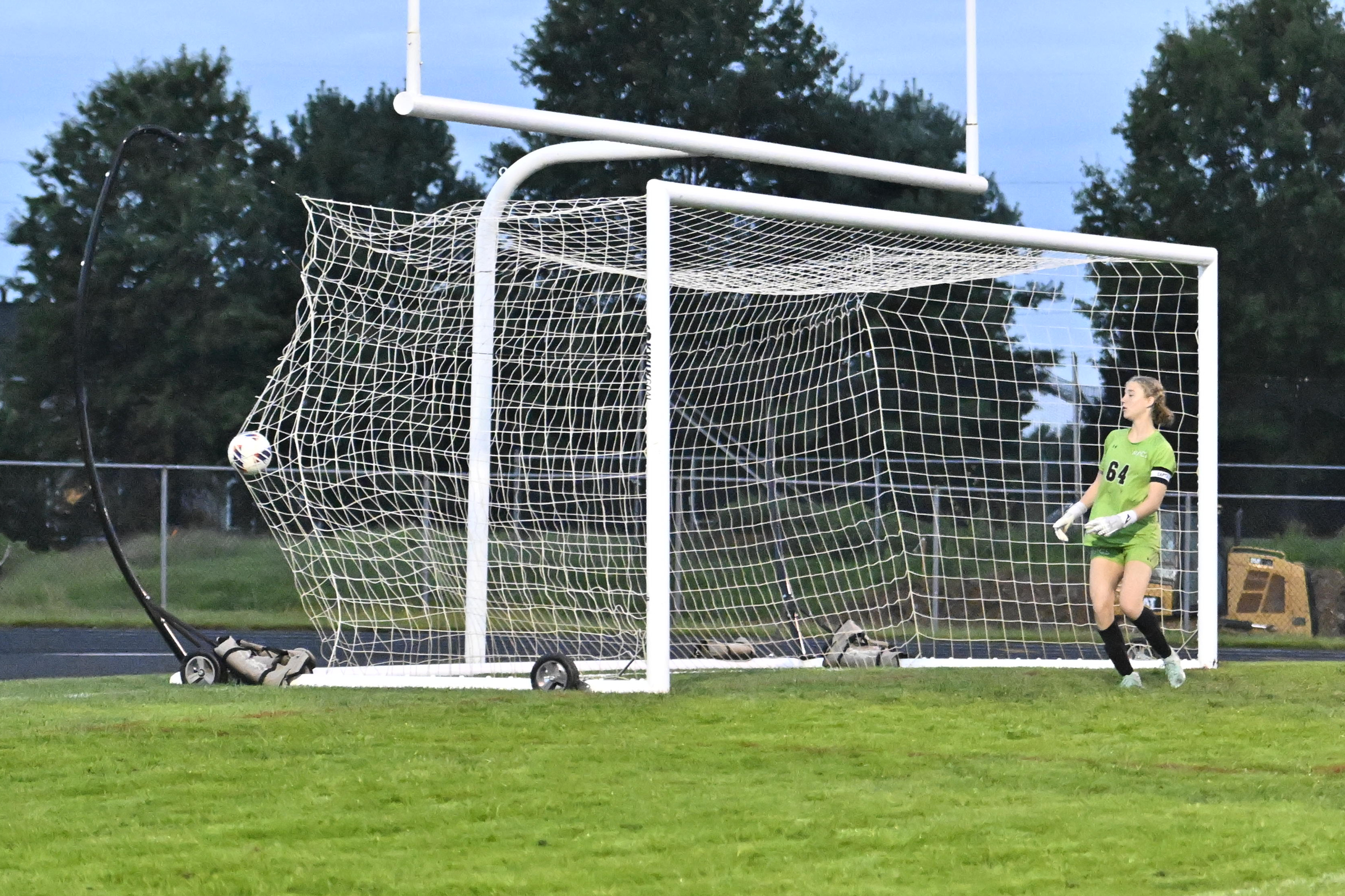 Roland Park's Avery Mason watches as the ball hits the...