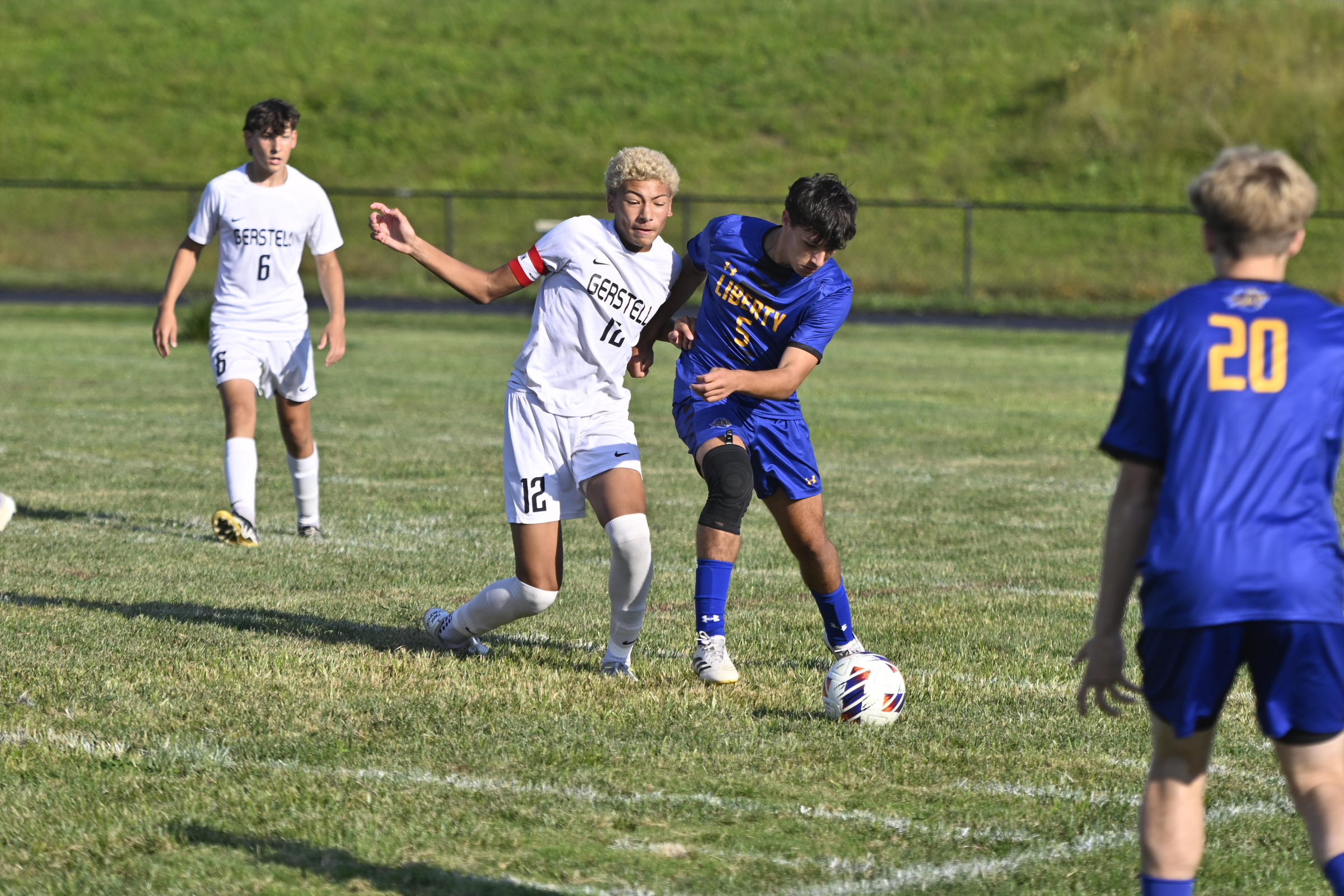 Ethan Carpenetti dribbles the ball past Gerstell's Amari Bowman during...