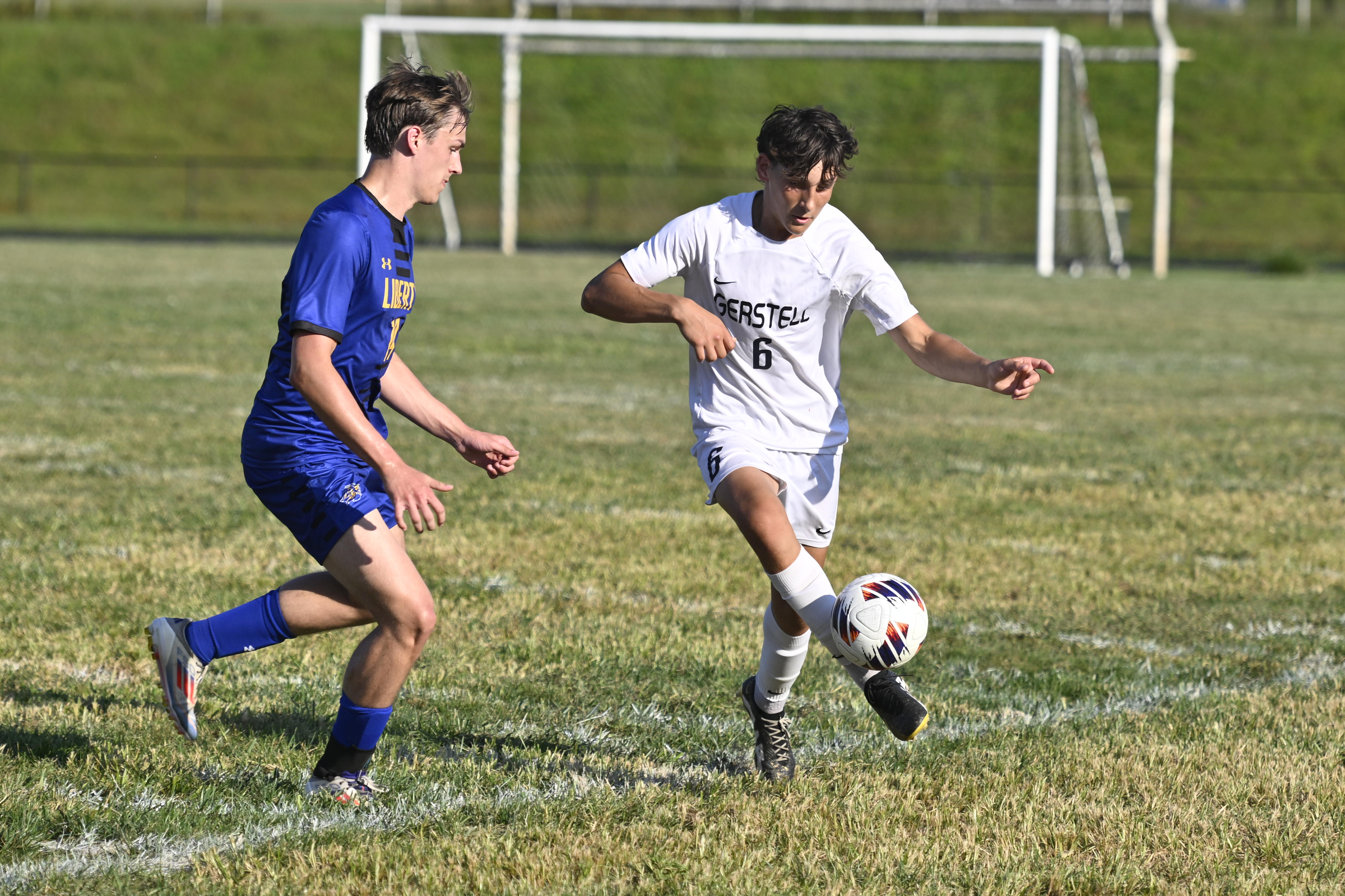 Gerstell's Liam Vazhnov kicks the ball in front of Brady...