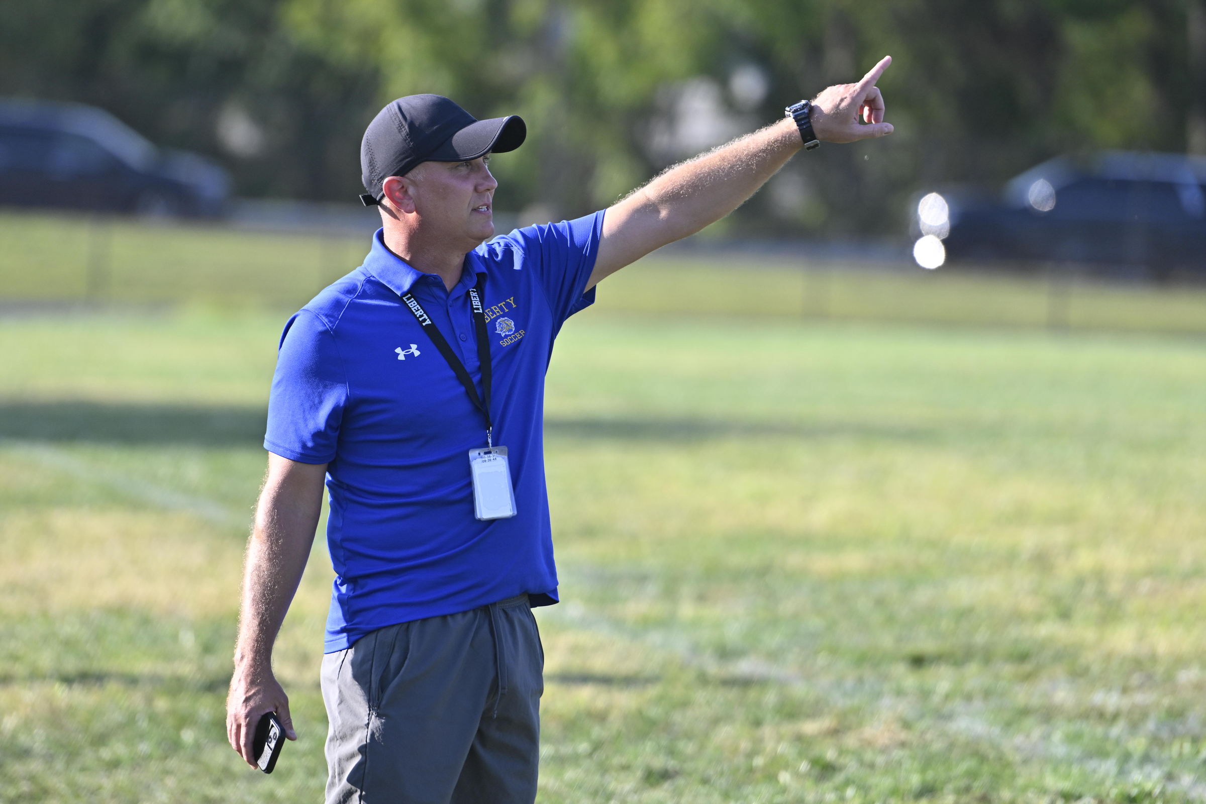 Liberty coach Donnie Kwedar gives instructions from the sidelines during...
