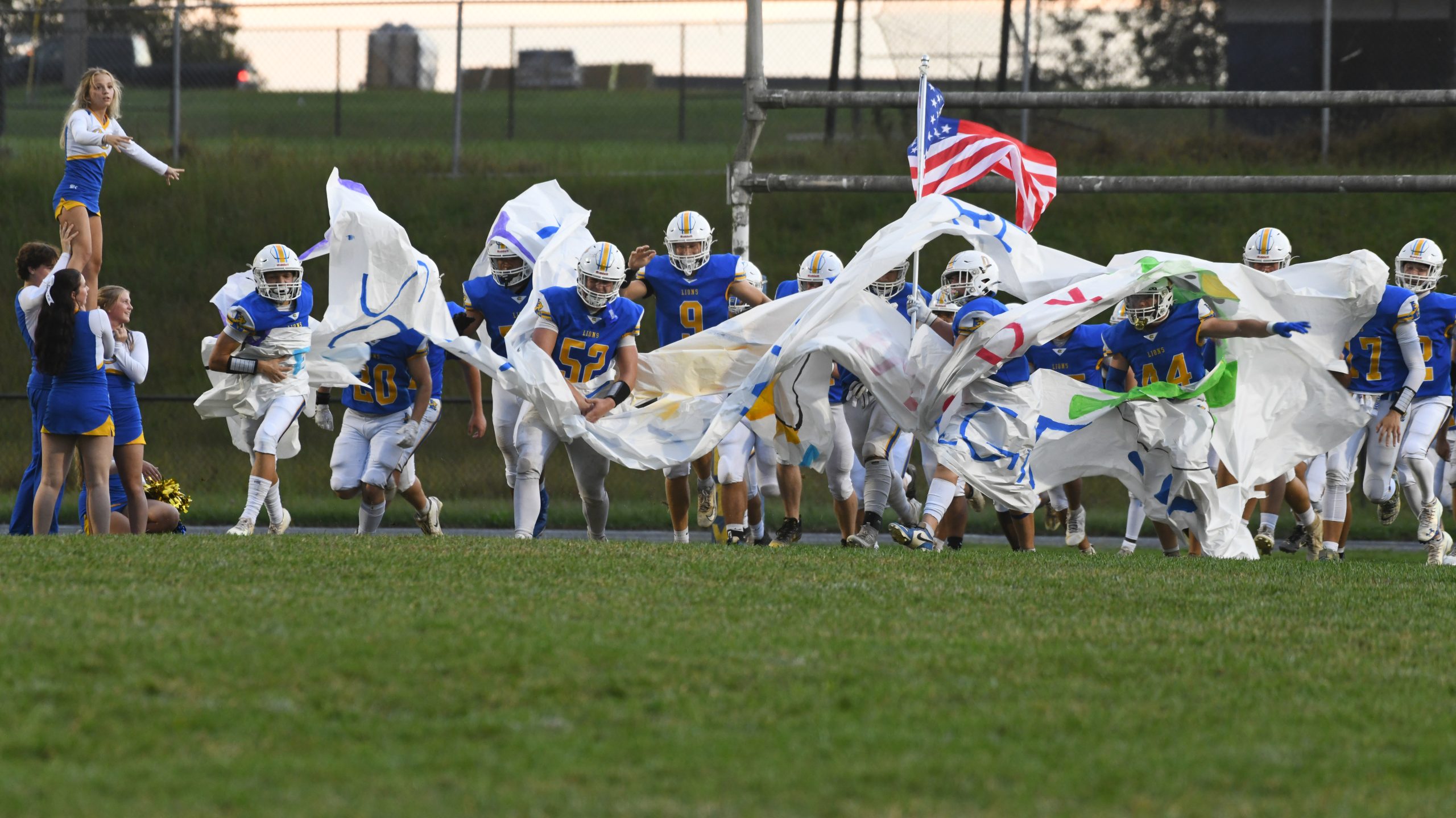 Liberty's football team takes the field before their game against...