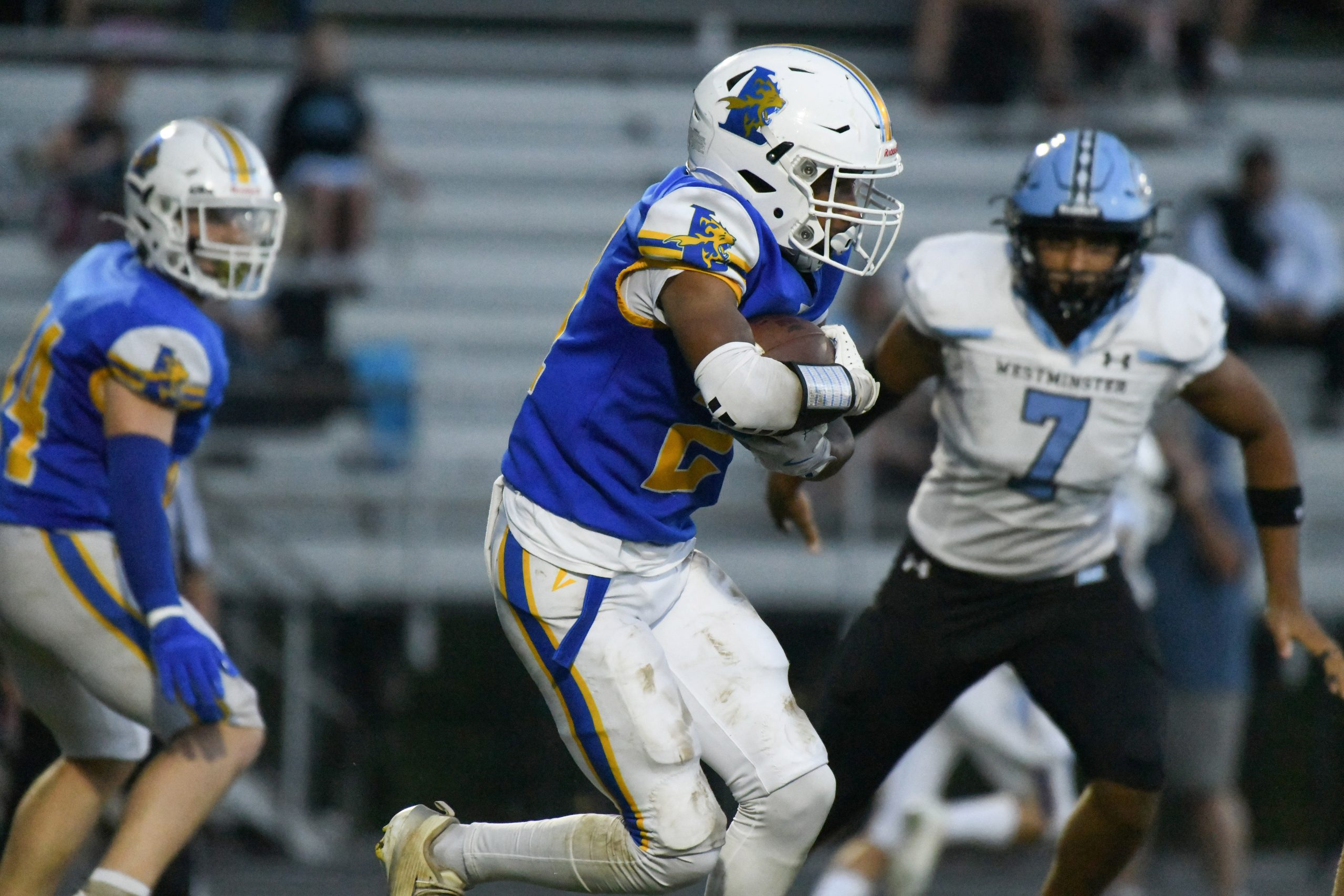 Liberty's Dillon Tate carries the ball against Westminster during a...