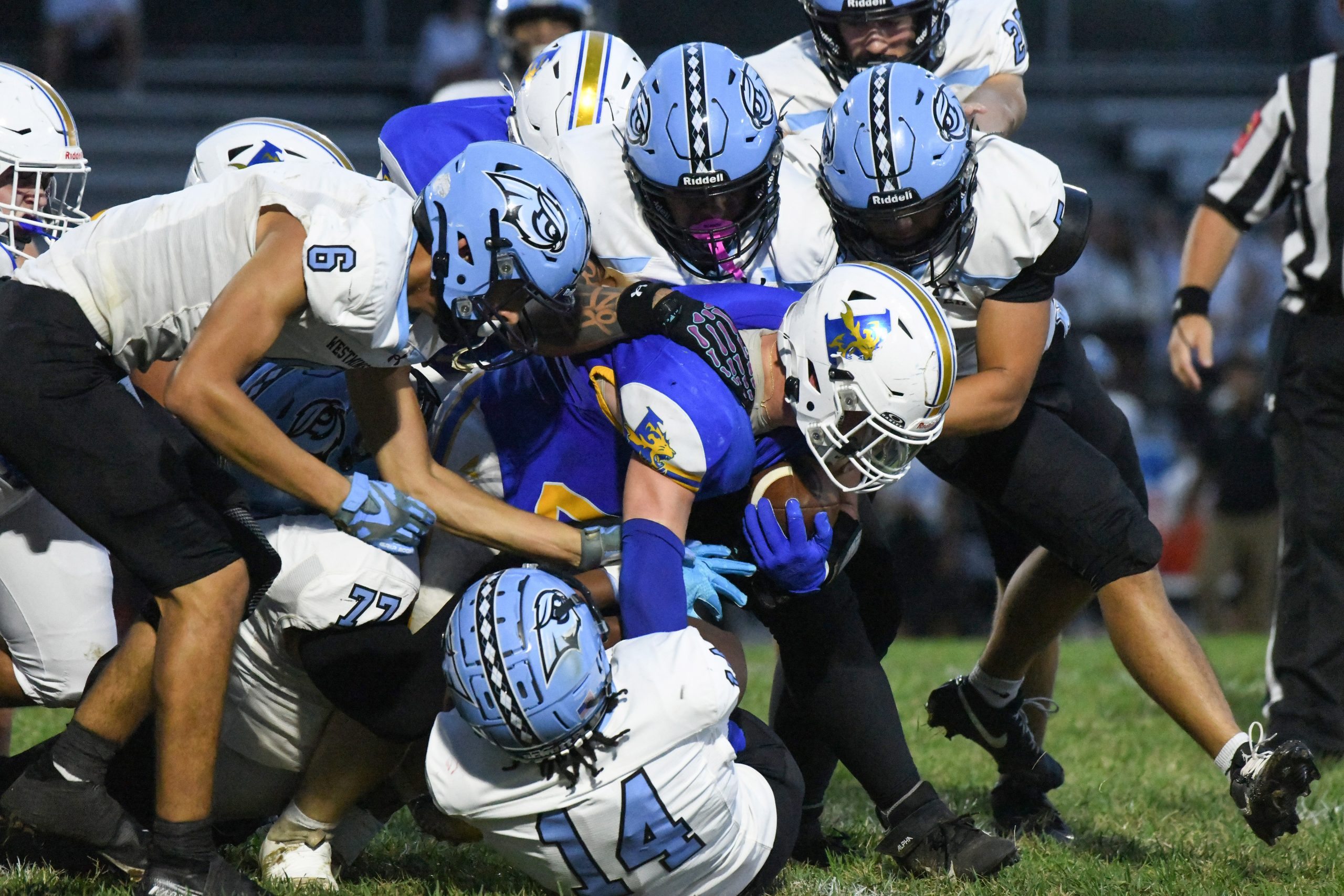 Liberty's Kevin Kern is tackled by a group of Westminster...