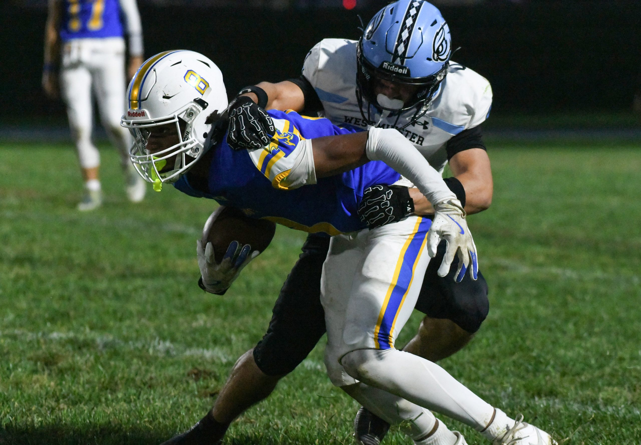 Liberty's Stephen Puckett tries to break free from a tackle...