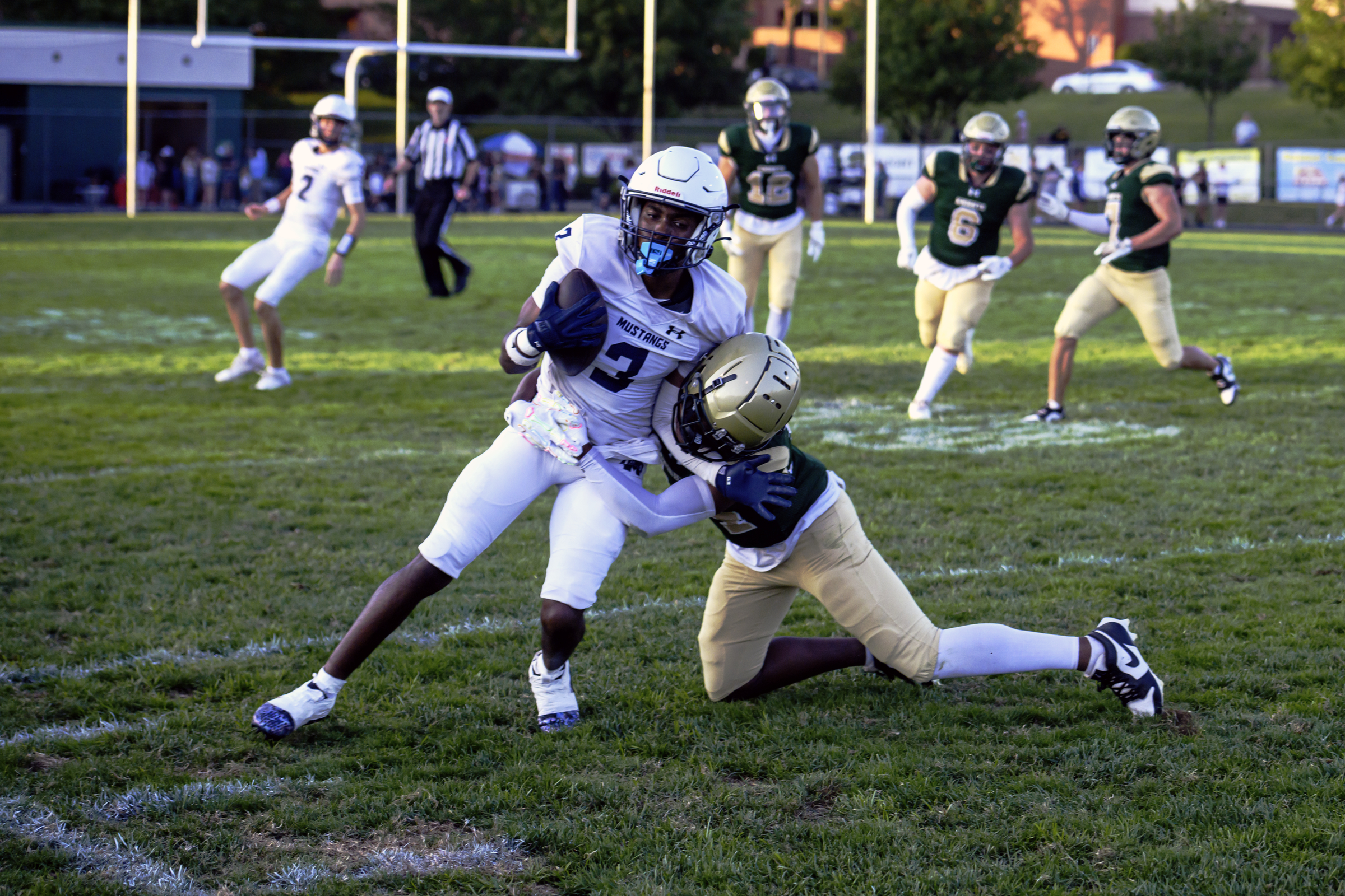 Marriotts Ridge's Scovens Cynsiere is tackled after catching a pass...