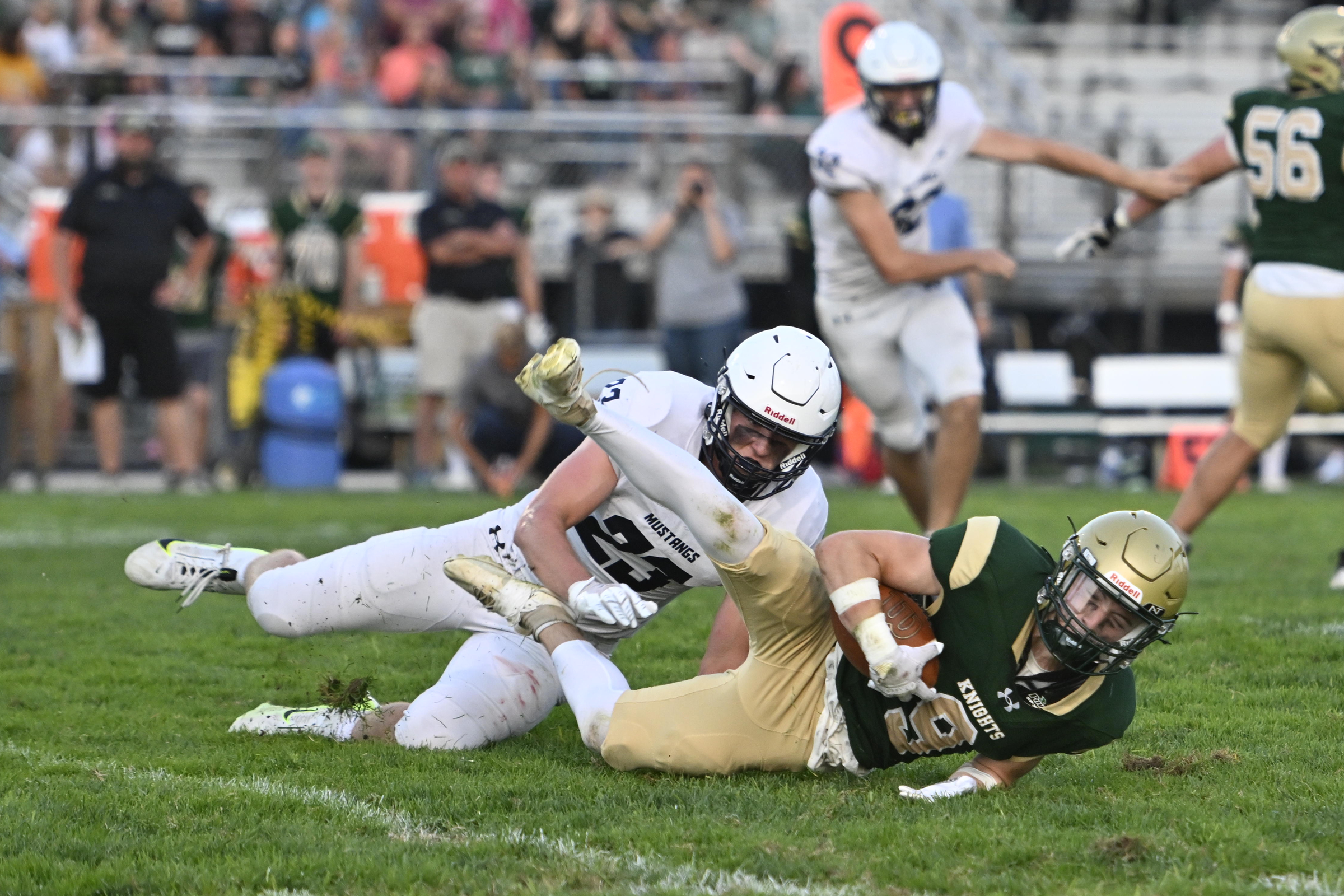 Marriotts Ridge's Cayden Fricke pulls down Dawson Jersey-Puga during a...