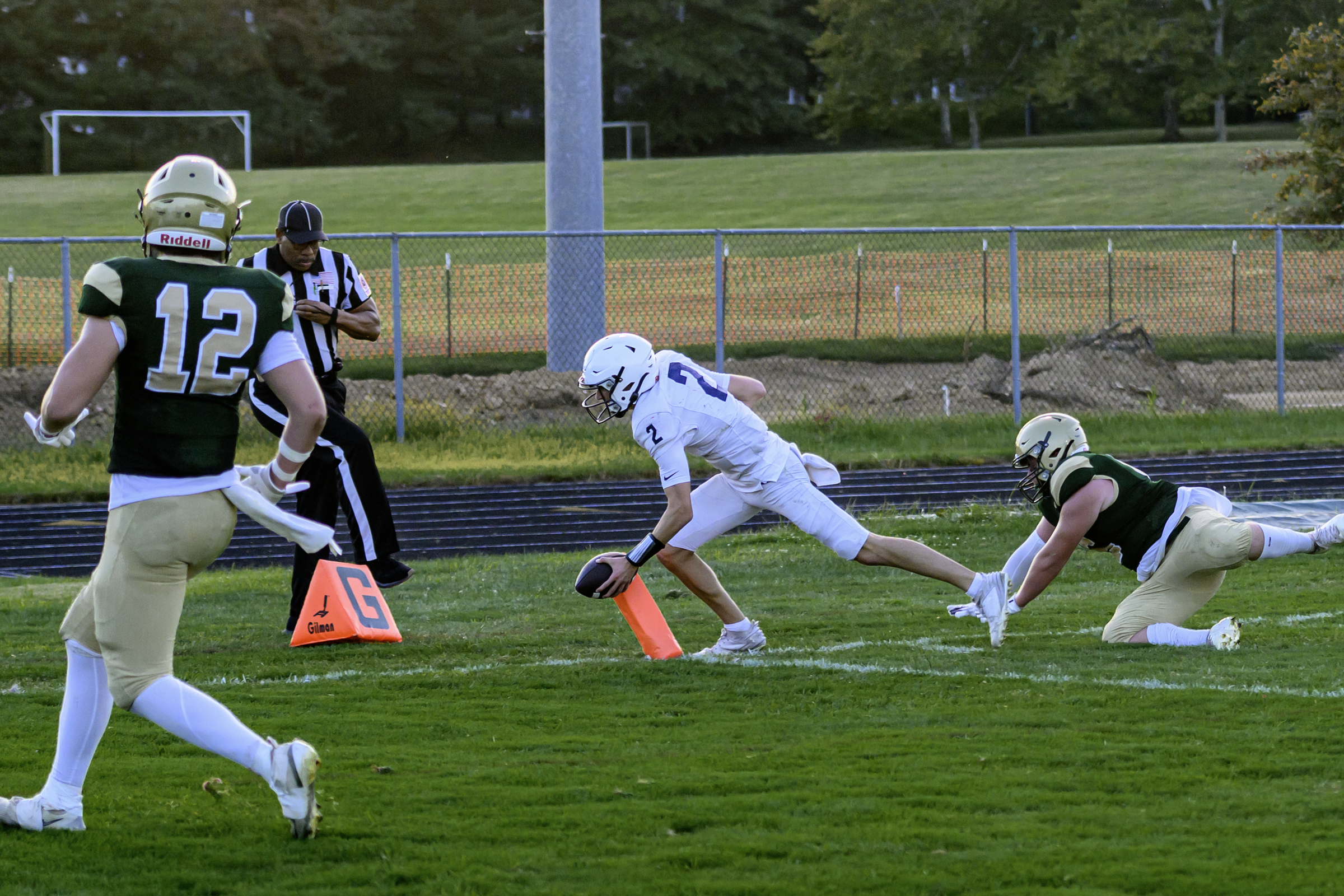 Marriotts Ridge's quarterback Blake Willingham reaches for the pilon to...