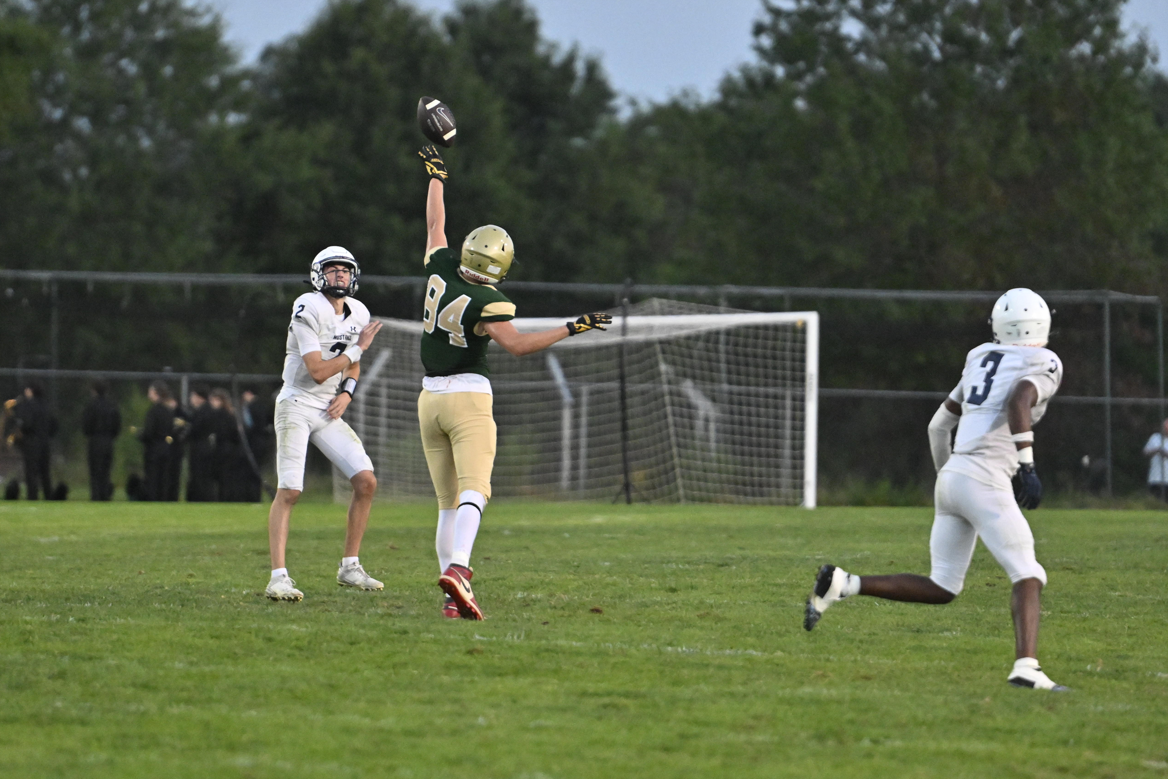 Brayden Johnson disrupts the pass from Marriotts Ridge's Blake Willingham...