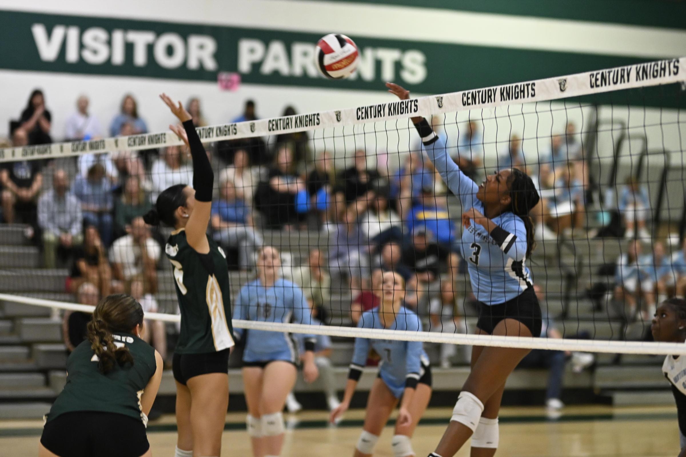 Westminster's Peyton Marrow strikes the ball during a volleyball game...